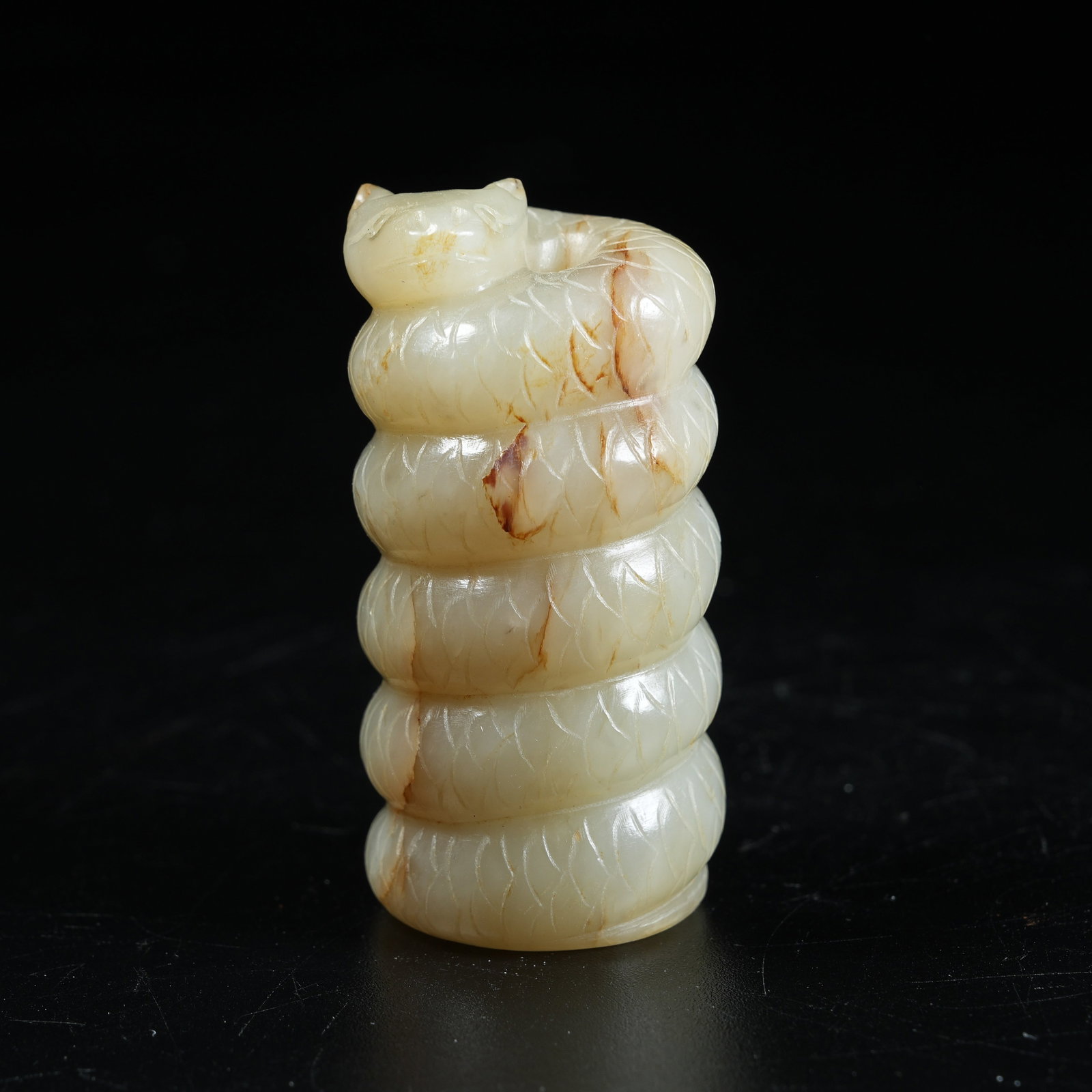 A ANCIENT JADE TUBE PENDANT WITH COILED SNAKE MOTIF (1 of 9)