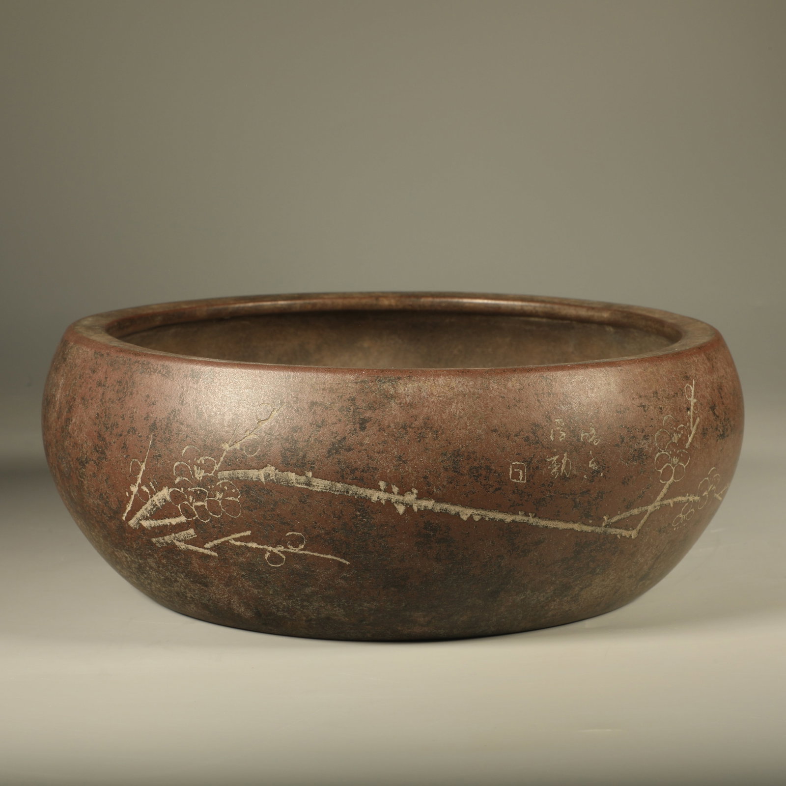 A YIXING ZISHA BRUSH WASHER CARVED WITH PLUM BLOSSOMS AND INSCRIBED VERSES (1 of 6)