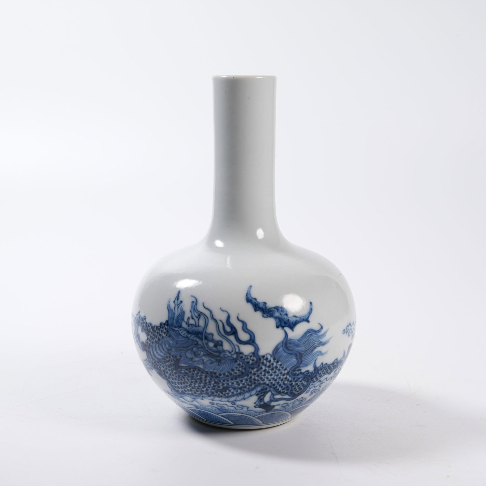 A BLUE AND WHITE LONG-NECK VASE WITH QILIN PATTERN (1 of 9)