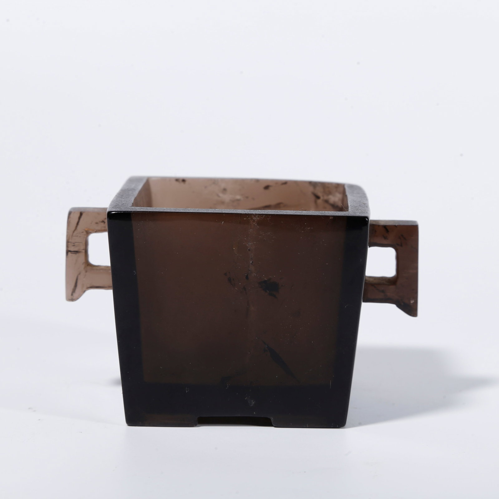 A SMOKY QUARTZ SQUARE QIN-STYLE CENSER WITH DOUBLE HALBERD-SHAPED HANDLES: Smoky quartz square qin-style censer with double halberd-shaped handles