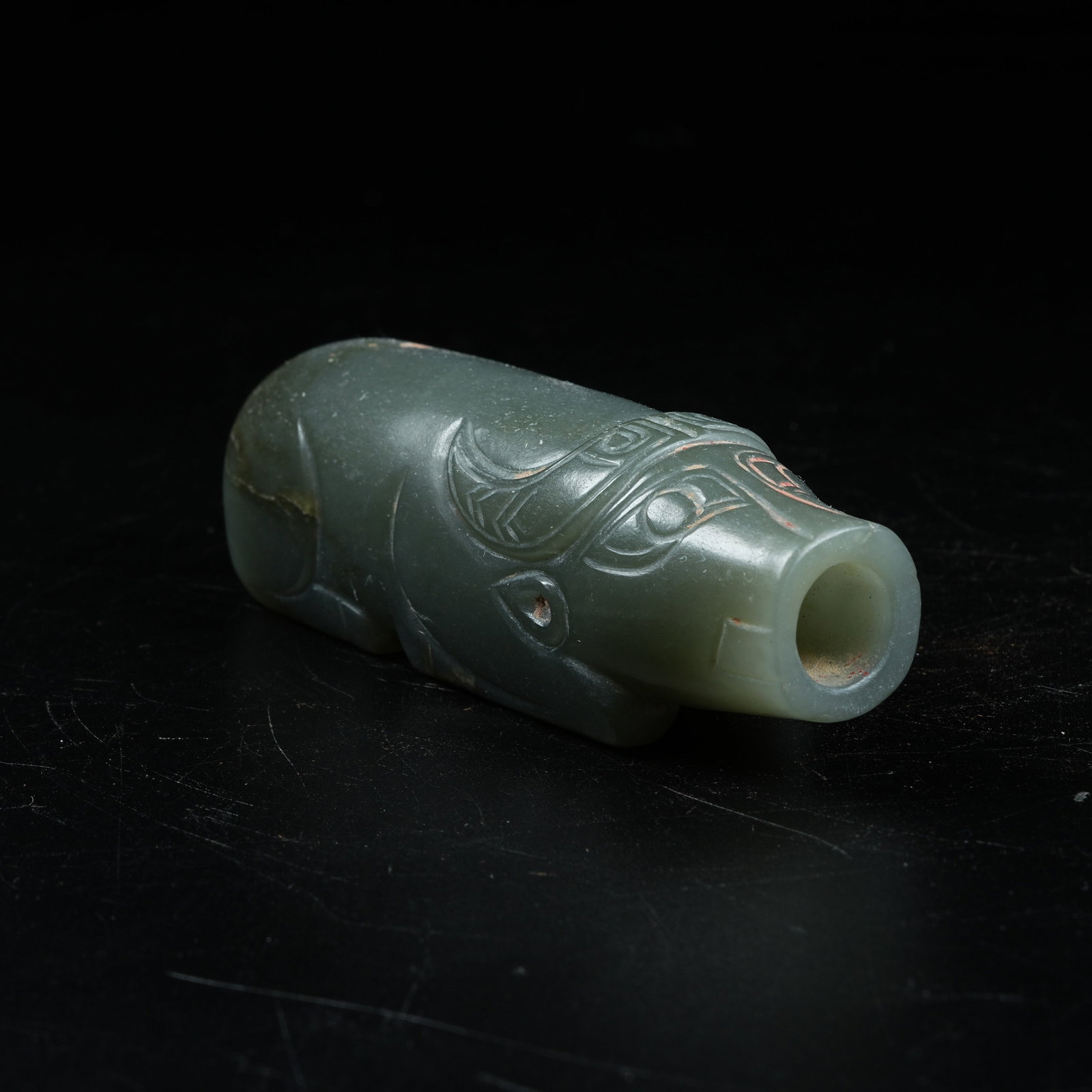 A ANCIENT JADE RECLINING OX ORNAMENT: Ancient Jade Reclining Ox Ornament