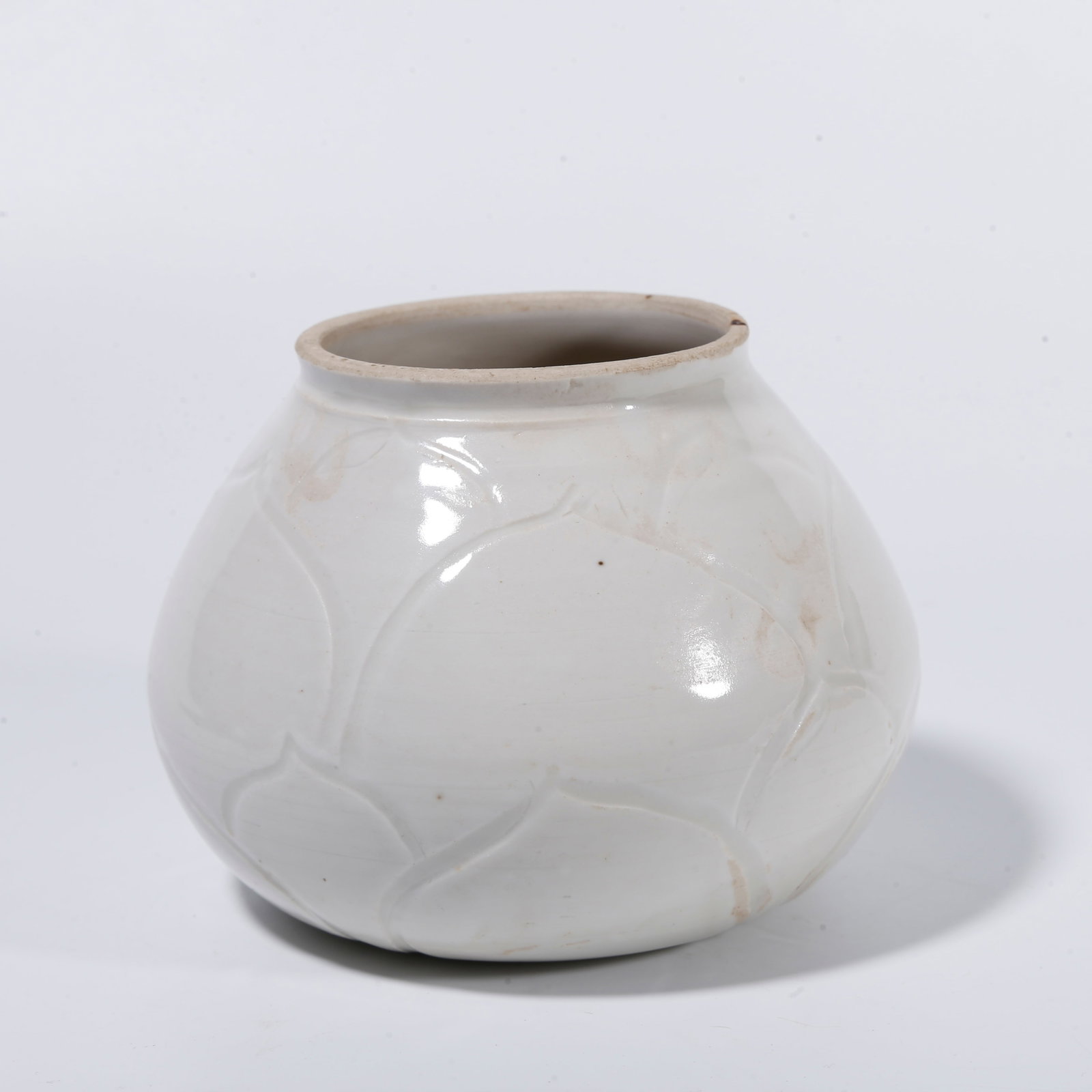 A DING WARE WATER DROPPER WITH LOTUS-PETAL PATTERN: Ding ware water dropper with lotus-petal pattern