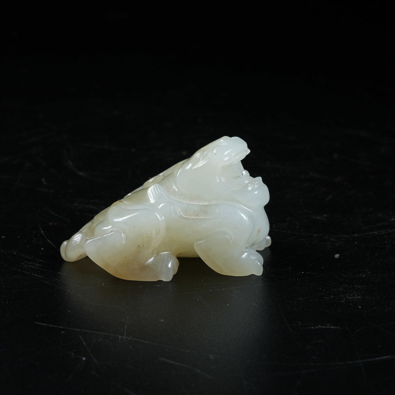 A HETIAN JADE AUSPICIOUS BEAST ORNAMENT: Hetian Jade Auspicious Beast Ornament