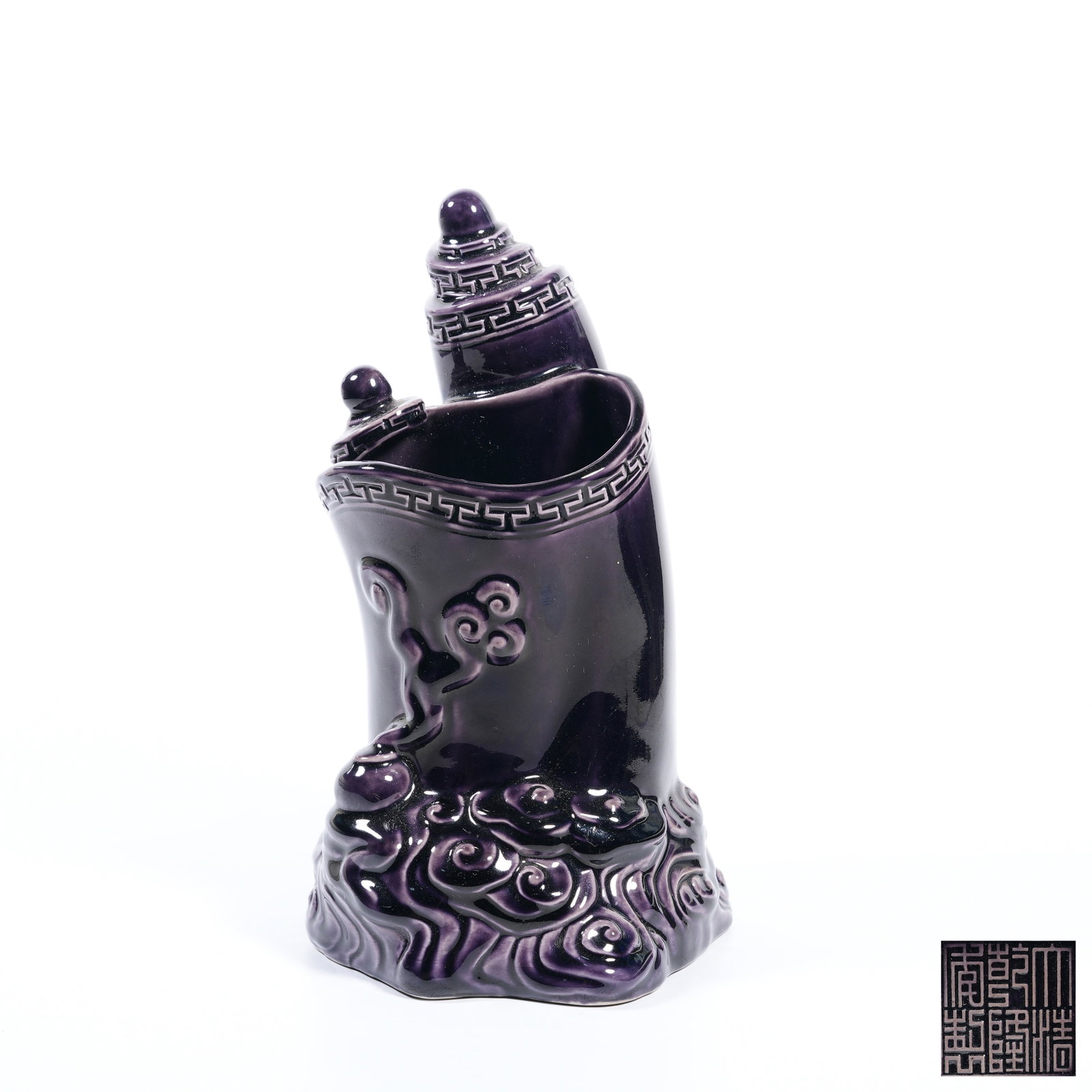 A EGGPLANT-PURPLE GLAZED SCROLL-SHAPED BRUSH POT (1 of 9)