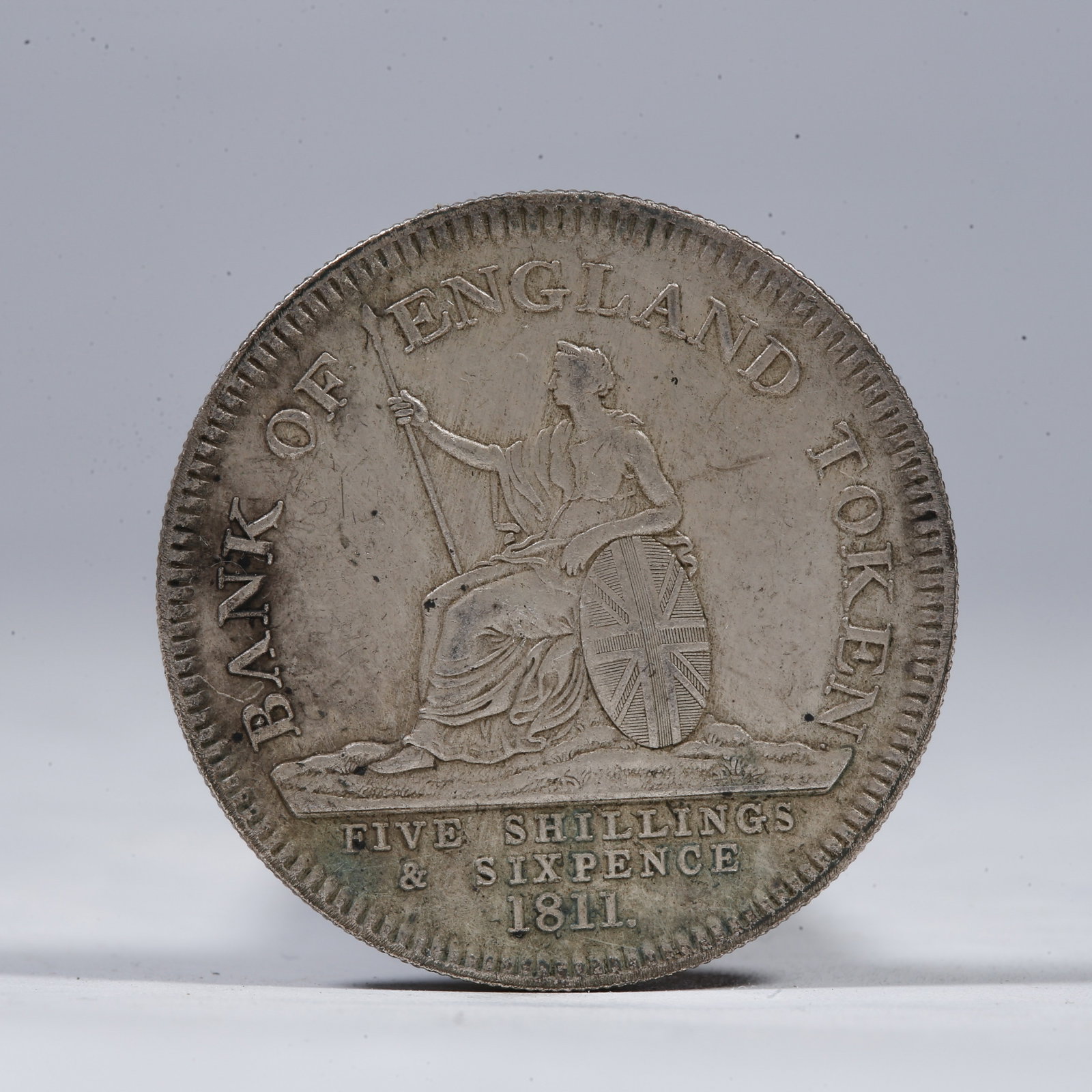 A SILVER DOLLAR COIN: One Silver Dollar Coin