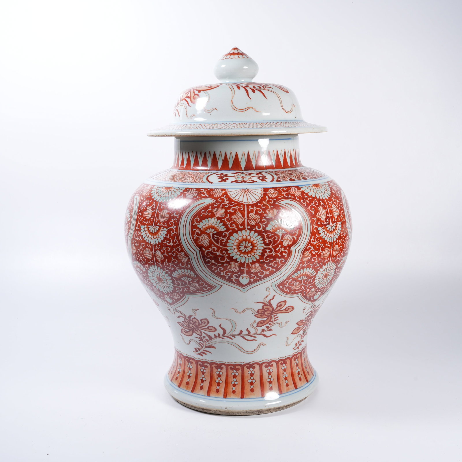 A IRON-RED GENERAL-STYLE JAR WITH INTERLOCKING FLORAL SCROLLS (1 of 9)