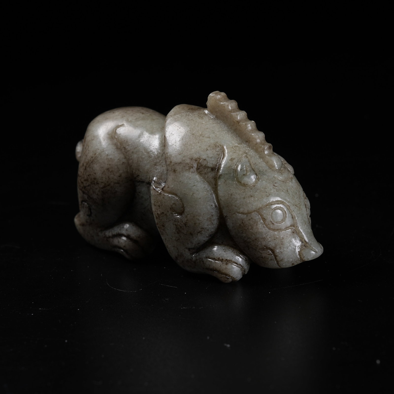 A ARCHAIC JADE DIVINE BEAST ORNAMENT: Archaic Jade Divine Beast Ornament