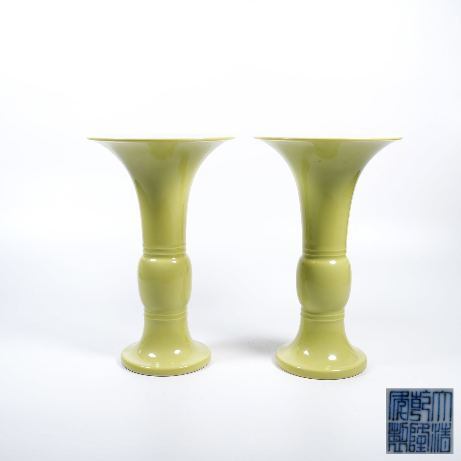 A PAIR OF LEMON-YELLOW GLAZED BEAKER VASES: Pair of Lemon-Yellow Glazed Beaker Vases