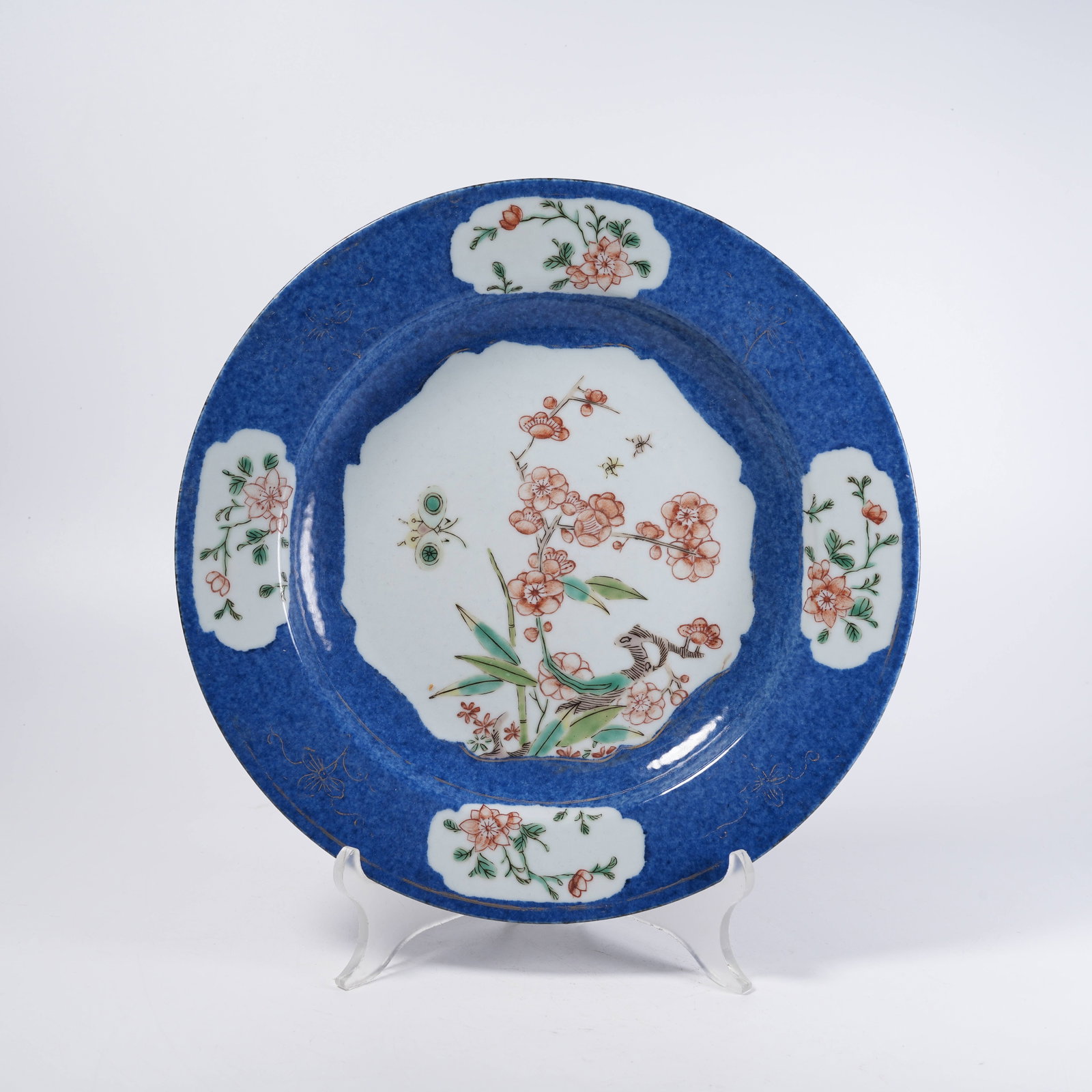 A RED AND GREEN PLATE WITH FLOWER AND BUTTERFLY PATTERNS (1 of 7)