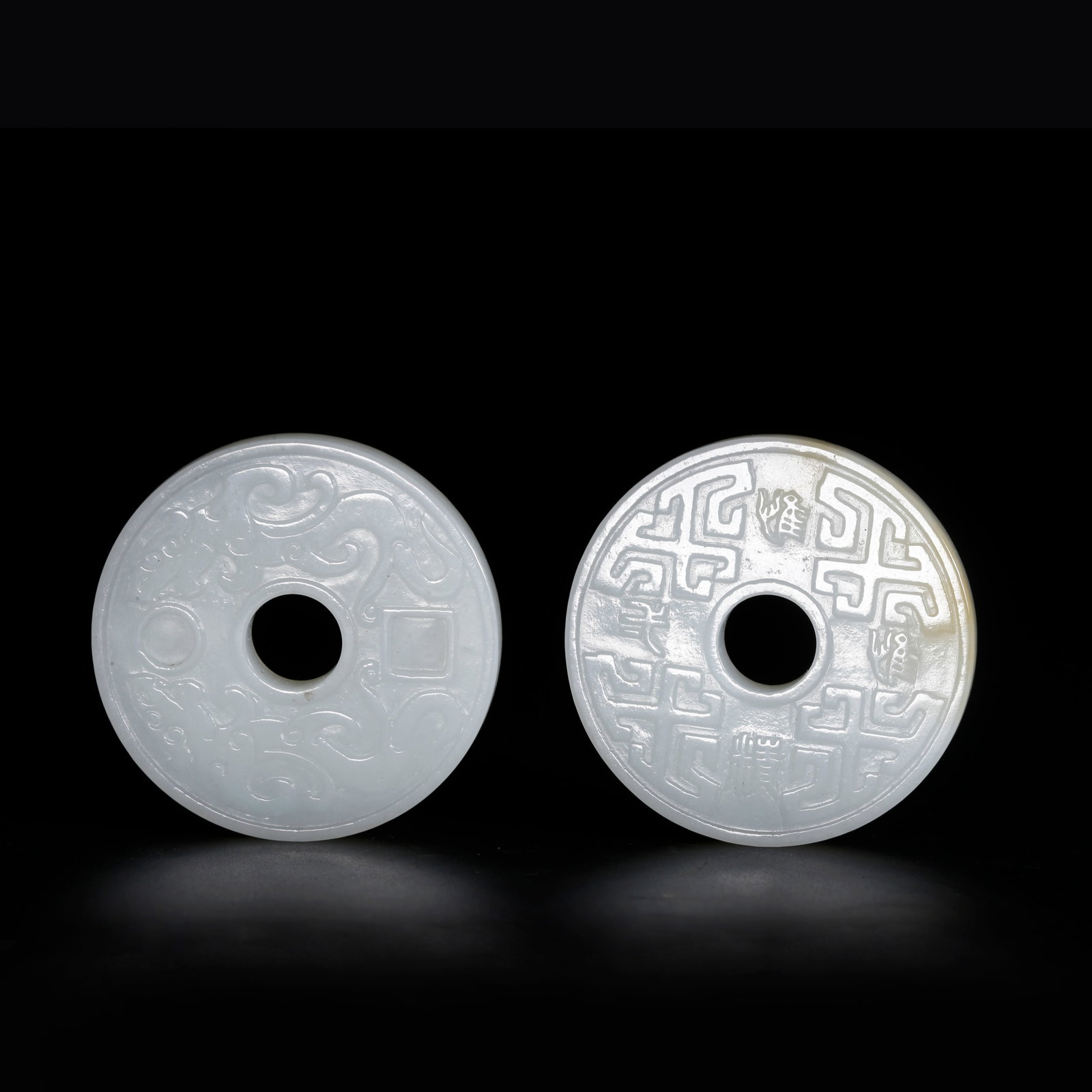 A HETIAN JADE BI DISC CARVED WITH BEAST PATTERN (1 of 9)