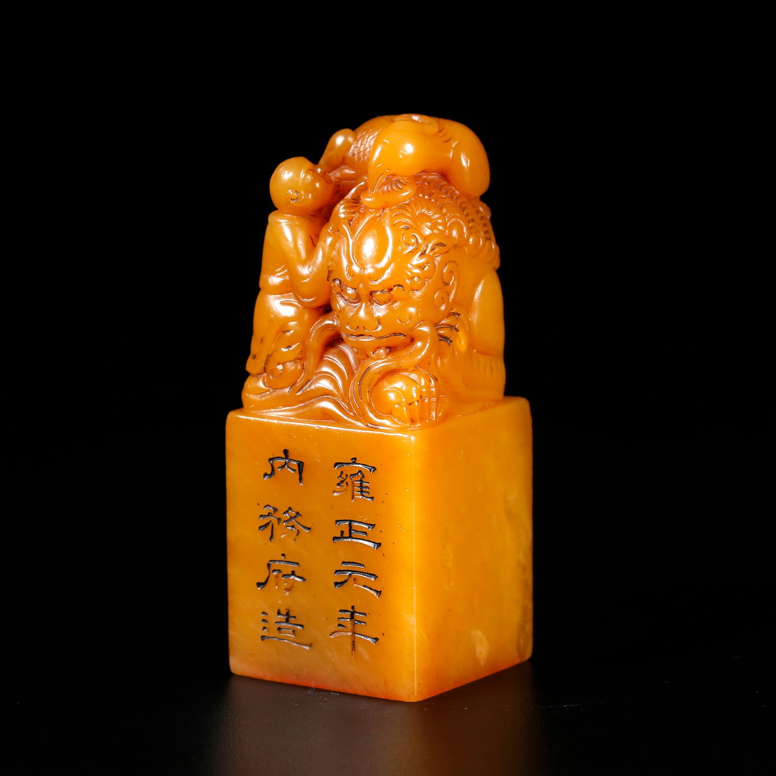 A SHOUSHAN FIELD-YELLOW STONE SEAL CARVED WITH MYTHICAL-BEAST KNOB: Shoushan field-yellow stone seal carved with mythical-beast knob