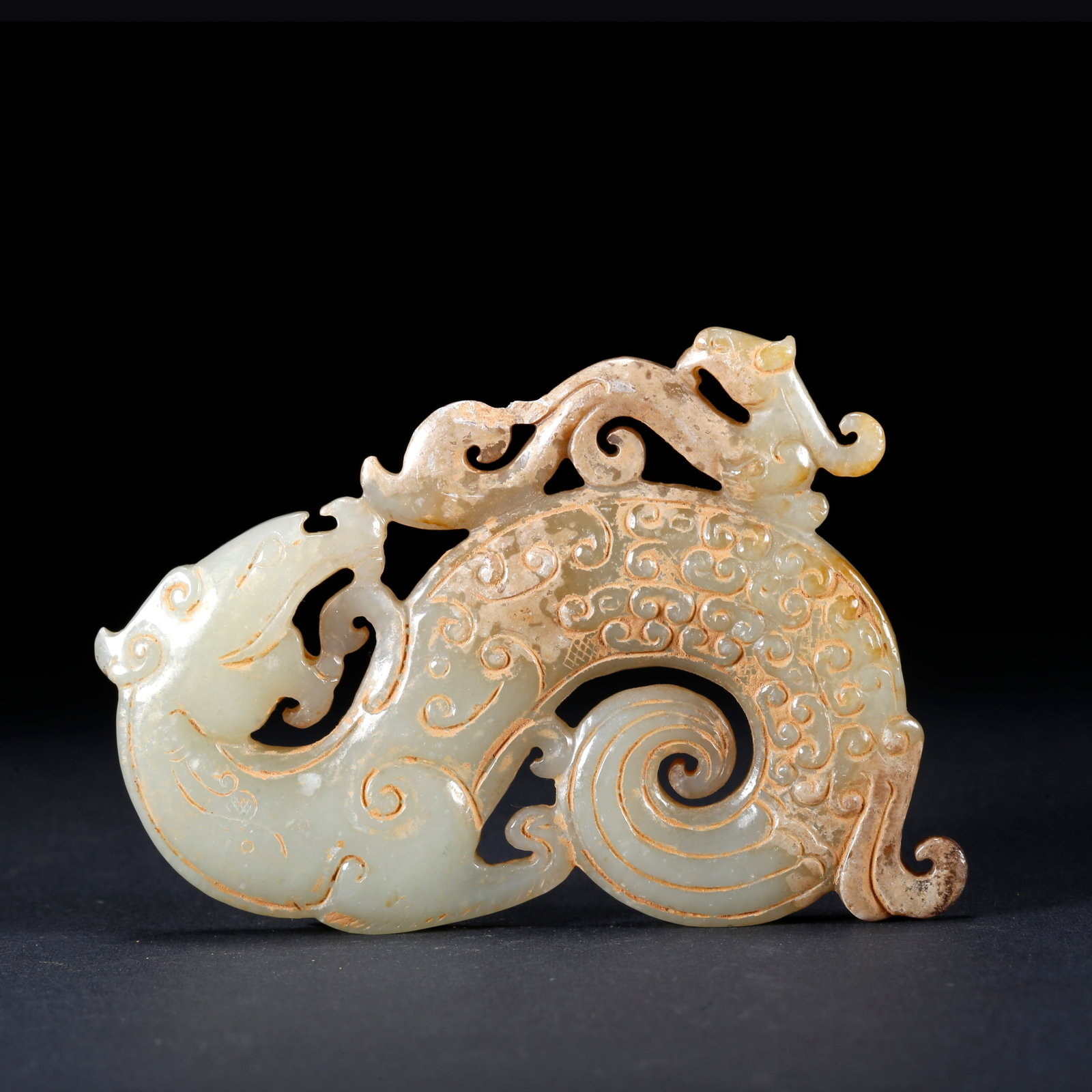 A ARCHAIC JADE PENDANT CARVED WITH DRAGON AND PHOENIX PATTERN: Archaic Jade Pendant Carved with Dragon and Phoenix Pattern