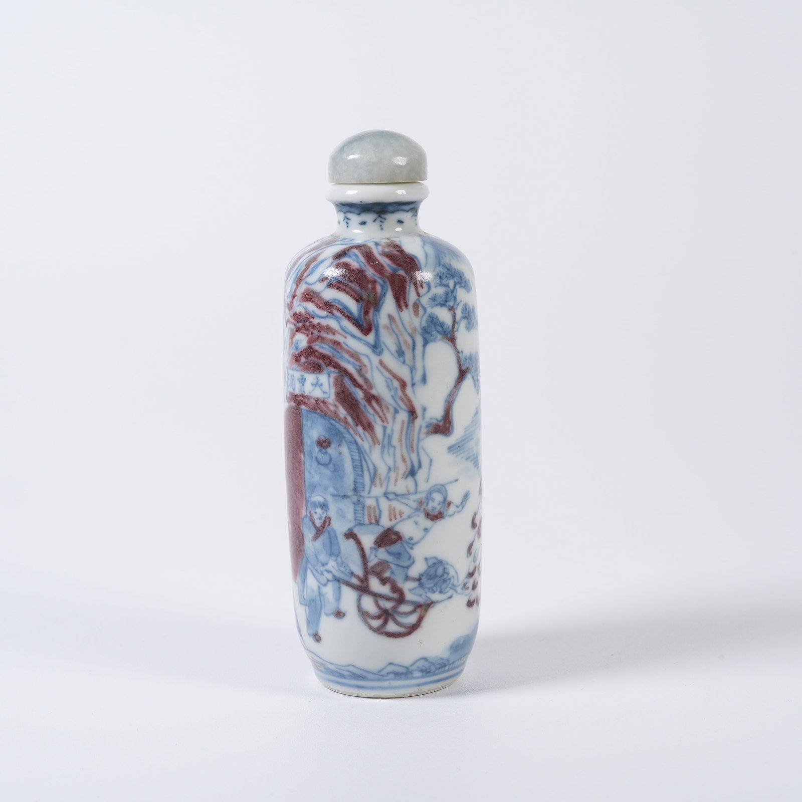 A BLUE-AND-WHITE UNDERGLAZE-RED SNUFF BOTTLE WITH JOURNEY-TO-THE-WEST FIGURE-STORY MOTIFS (1 of 10)