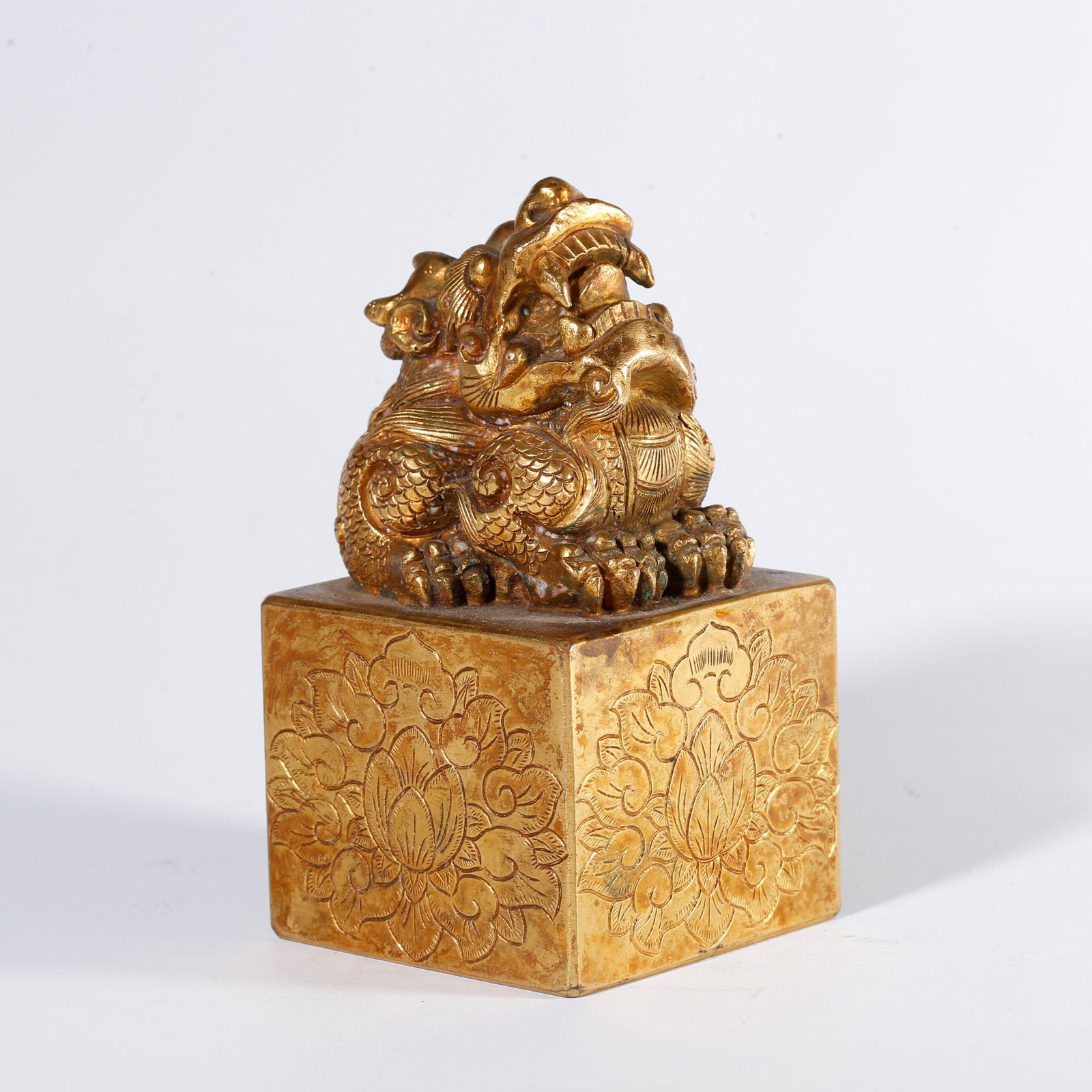 A GILT BRONZE SEAL WITH BEAST KNOB: Gilt Bronze Seal with Beast Knob