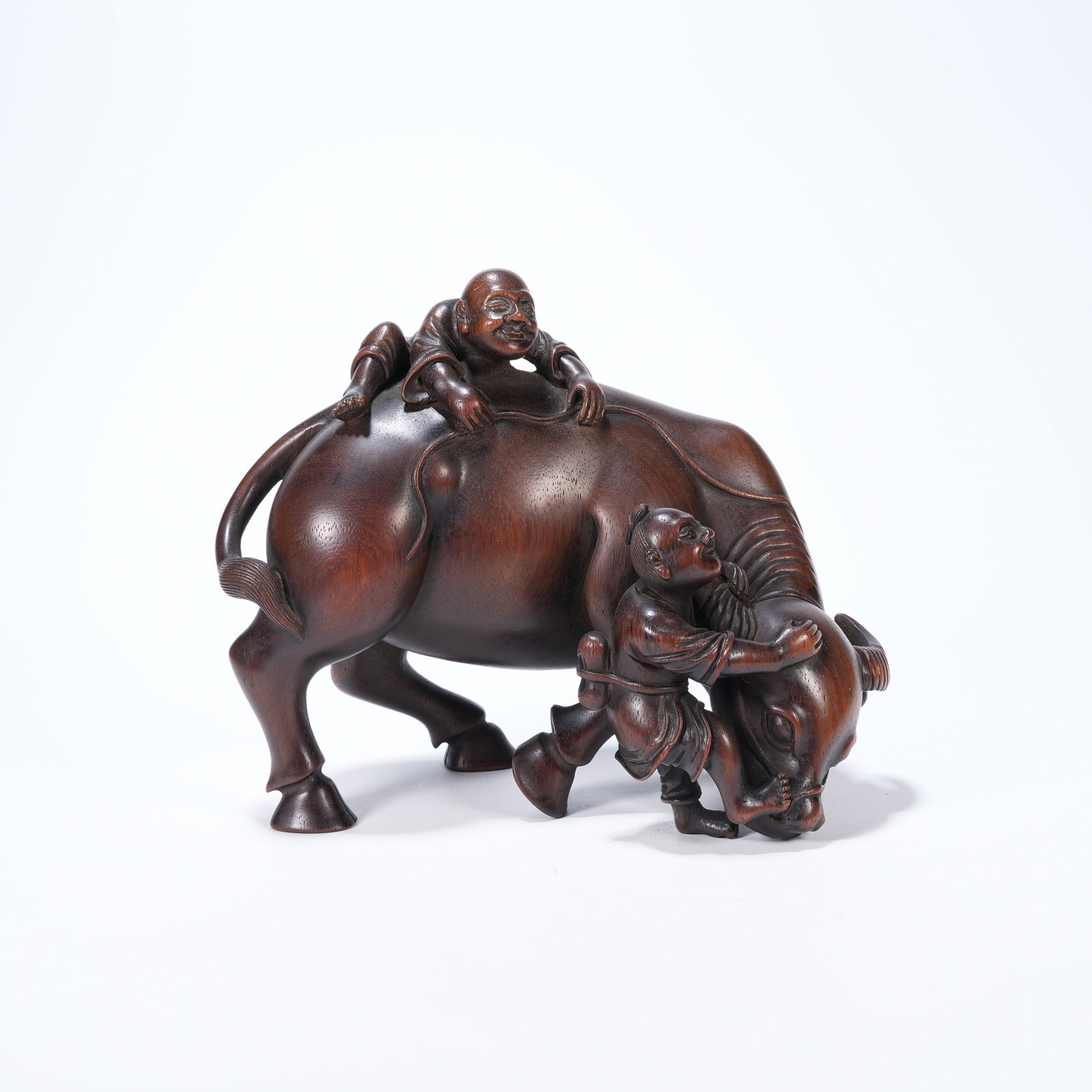 A HUANGHUALI CARVED ORNAMENT OF BOY PLAYING WITH OX (1 of 8)