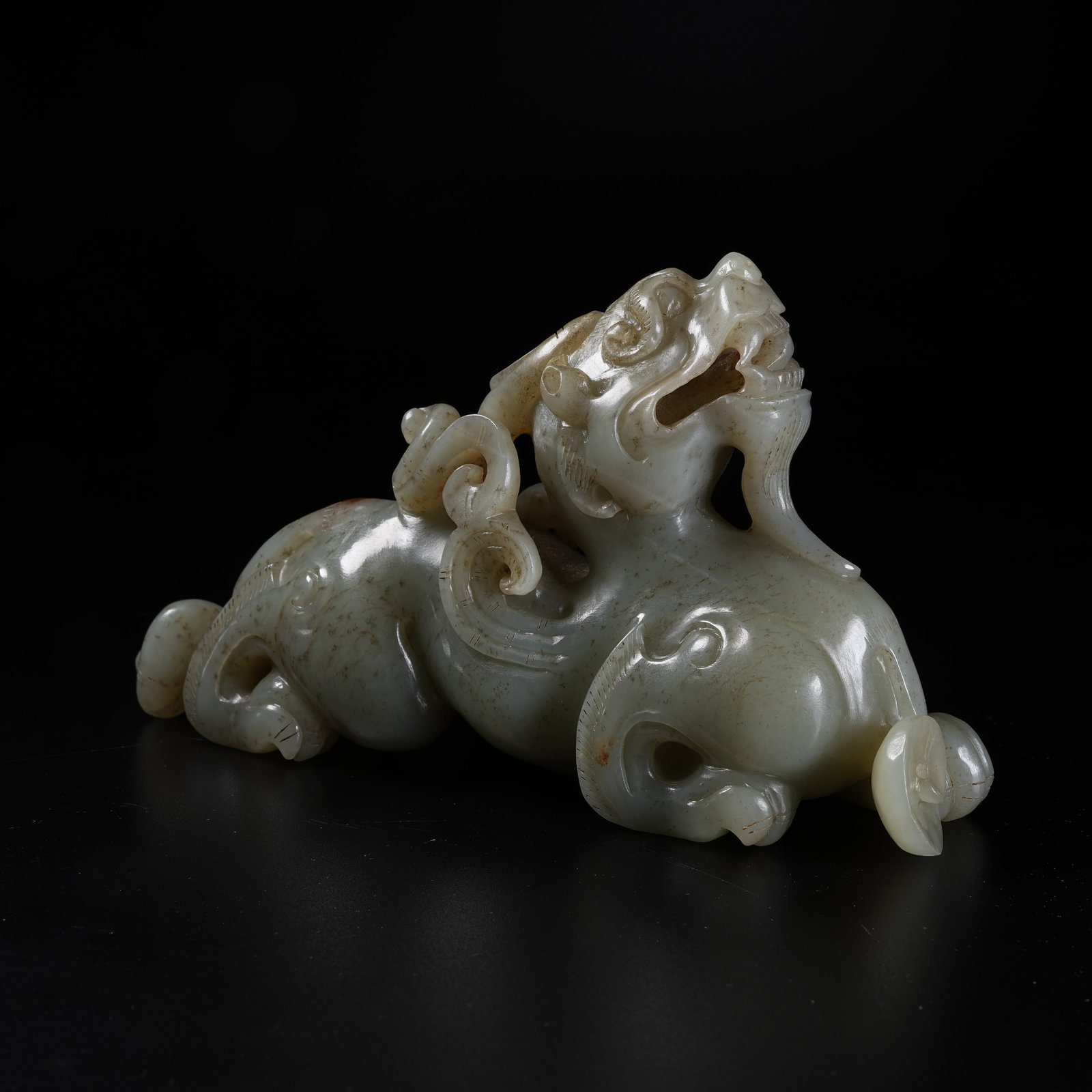 A ARCHAIC JADE RECUMBENT BEAST ORNAMENT: Archaic Jade Recumbent Beast Ornament