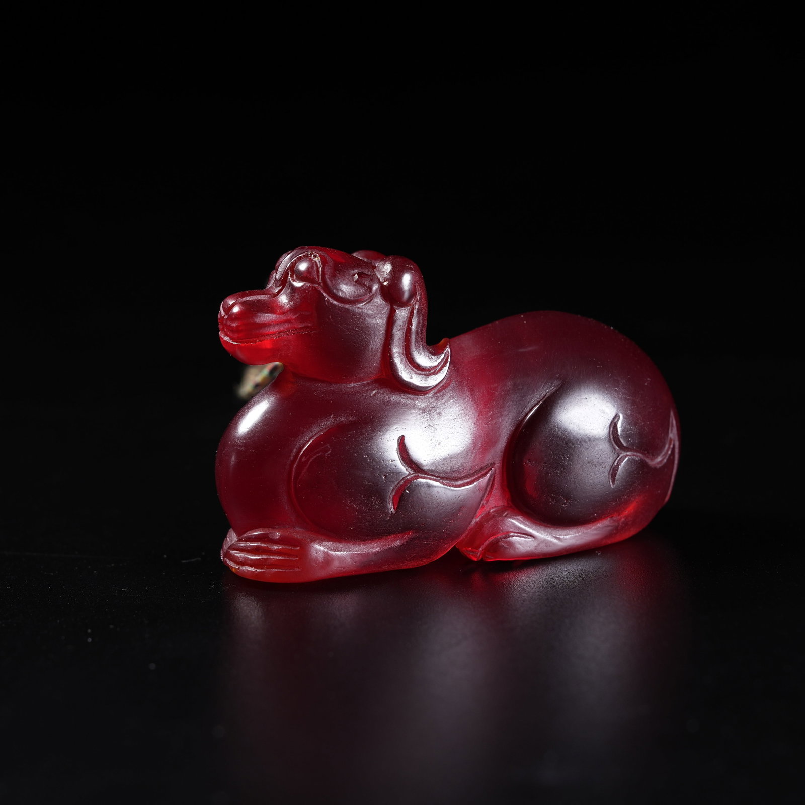 A RUBY RECUMBENT BEAST ORNAMENT: Ruby Recumbent Beast Ornament