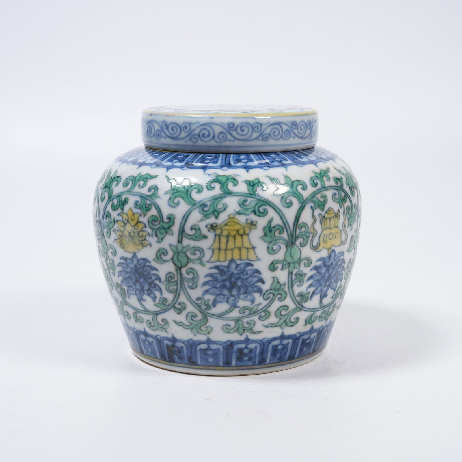 A DOUCAI HEAVENLY CHARACTER JAR WITH INTERLOCKING LOTUS AND EIGHT TREASURES PATTERNS: Doucai Heavenly Character Jar with Interlocking Lotus and Eight Treasures Patterns