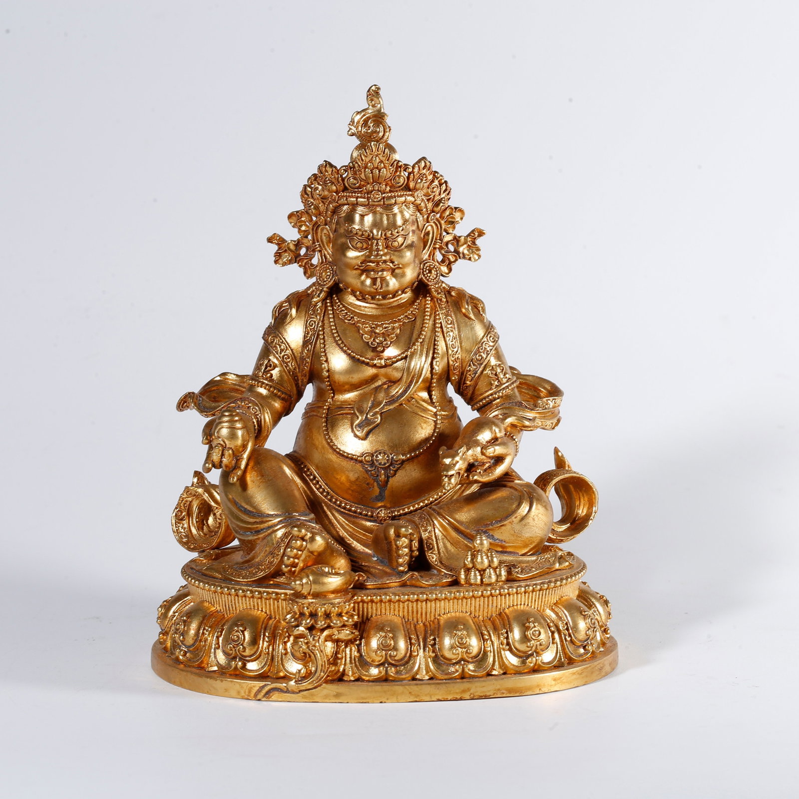 A GILT BRONZE STATUE OF YELLOW JAMBHALA: Gilt Bronze Statue of Yellow Jambhala
