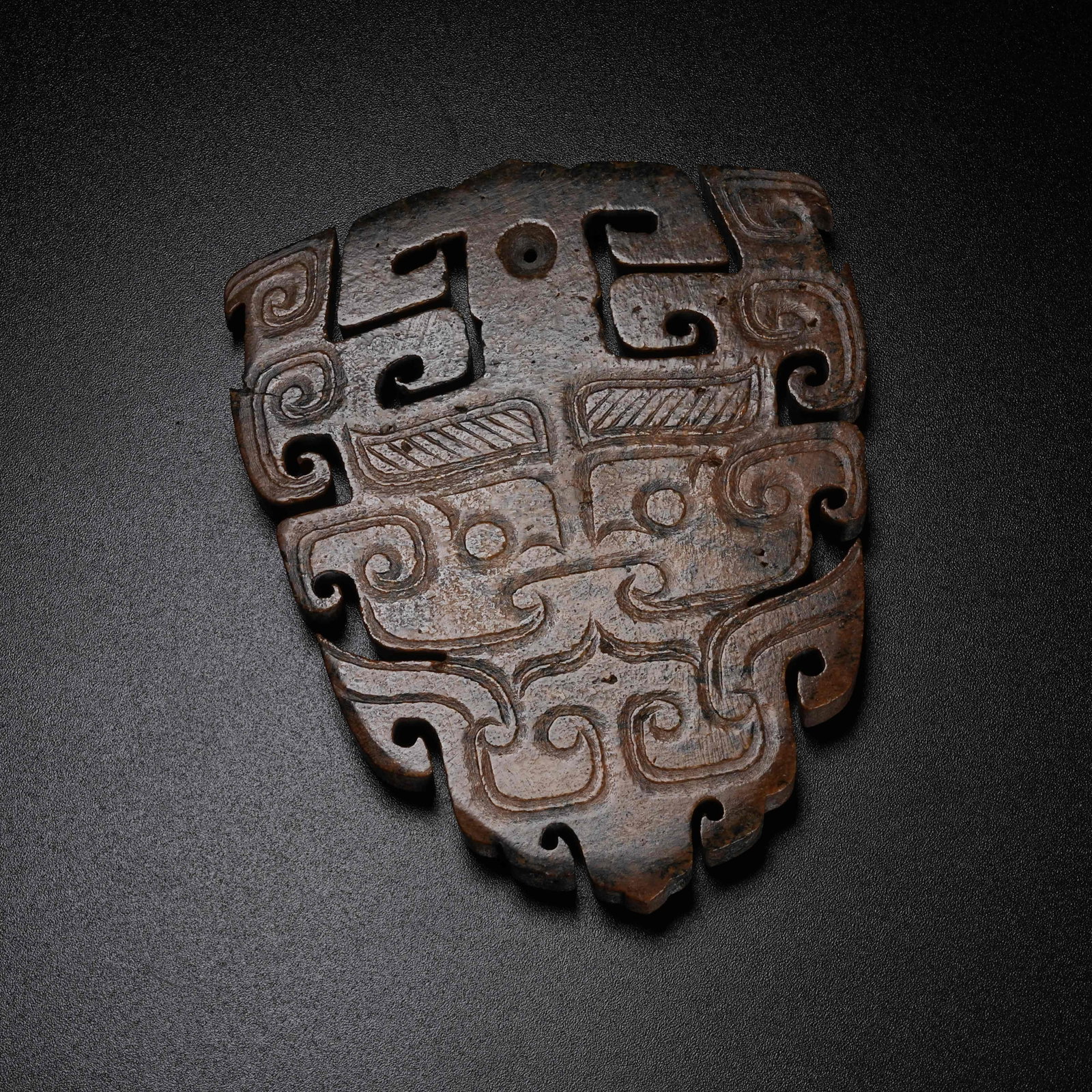 A ARCHAIC JADE PENDANT WITH BEAST MASK PATTERN: Archaic Jade Pendant with Beast Mask Pattern
