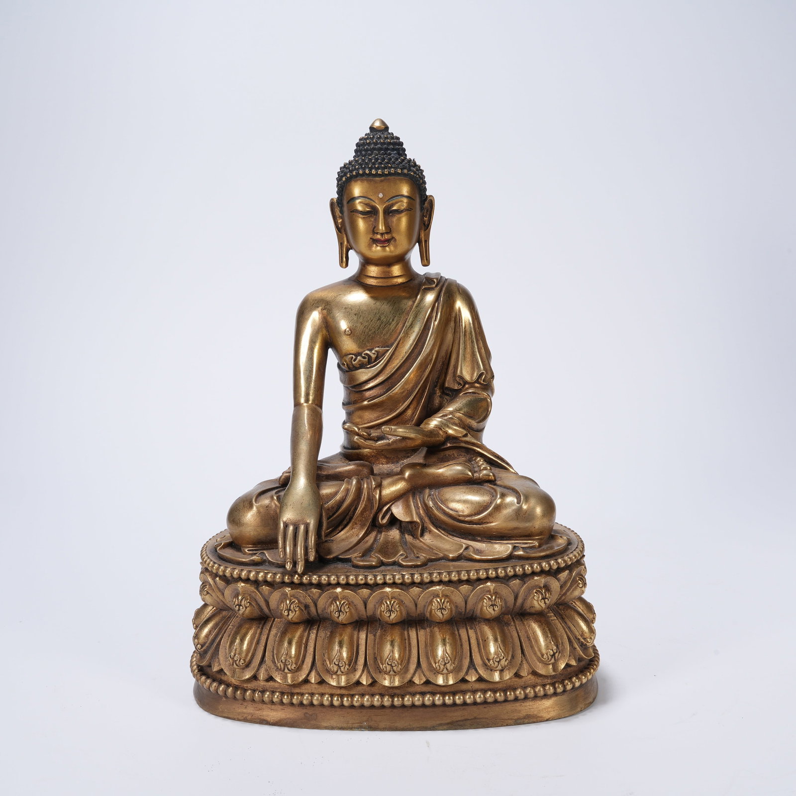 A GILT-BRONZE SAKYAMUNI BUDDHA FIGURE (1 of 9)