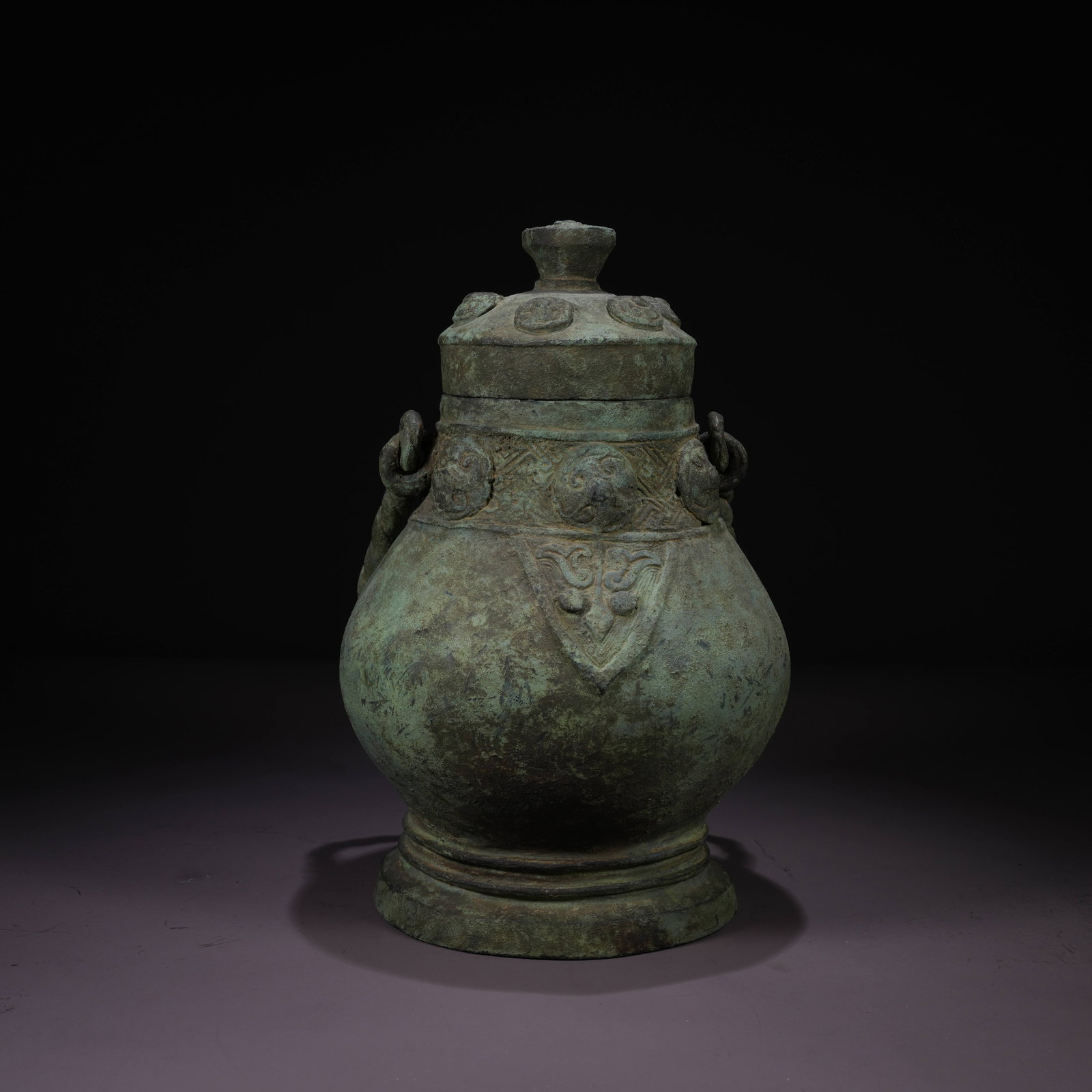 A BRONZE YOU VESSEL WITH TAOTIE MASK AND SWING HANDLE (1 of 9)