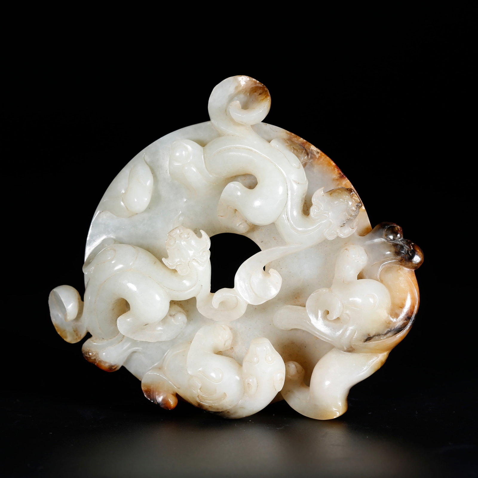 A HETIAN JADE BI DISC CARVED WITH DRAGON PATTERN: Hetian Jade Bi Disc Carved with Dragon Pattern