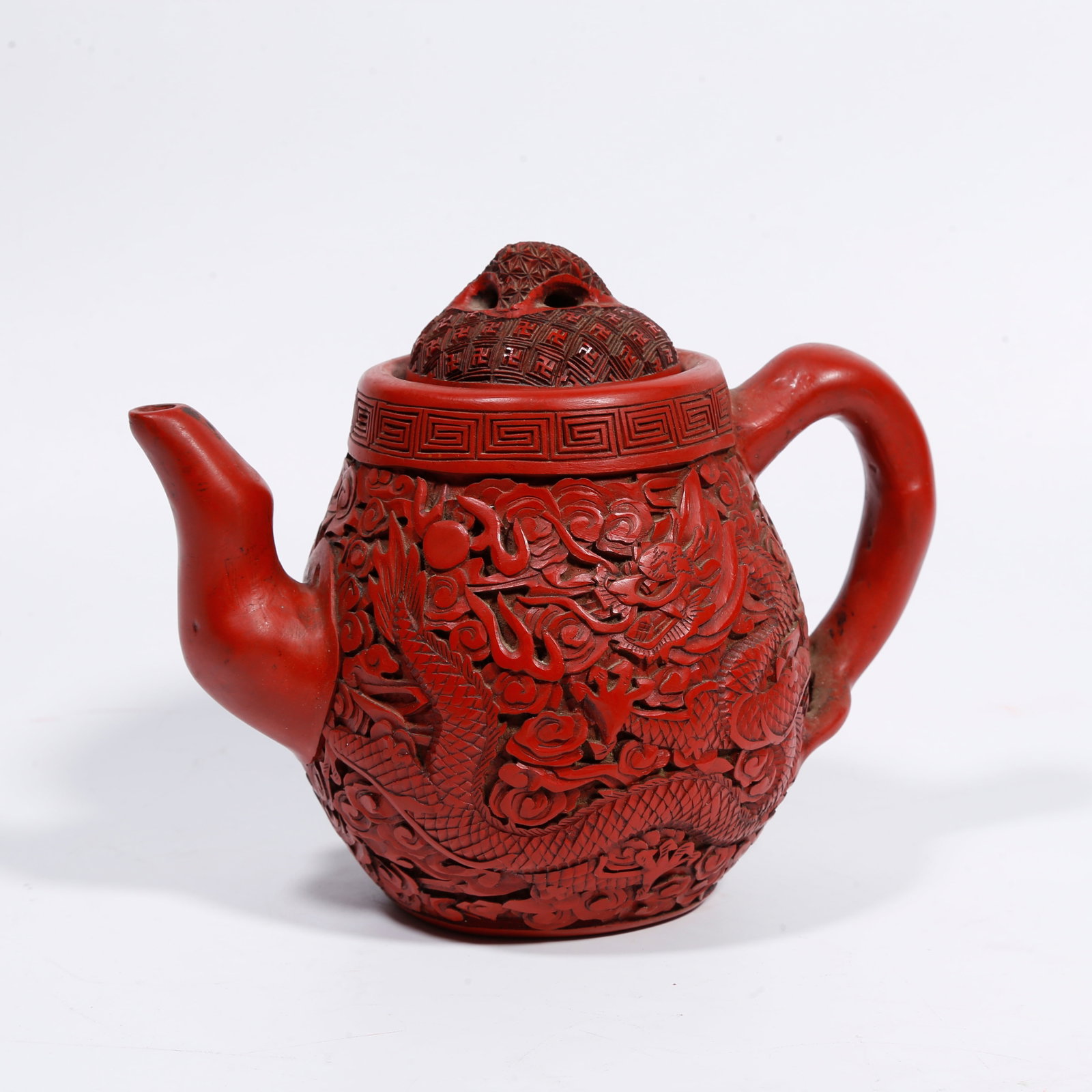 A YIXING-CLAY-BODY CARVED-RED EWER WITH CLOUD-DRAGON PATTERN: Yixing-clay-body carved-red ewer with cloud-dragon pattern