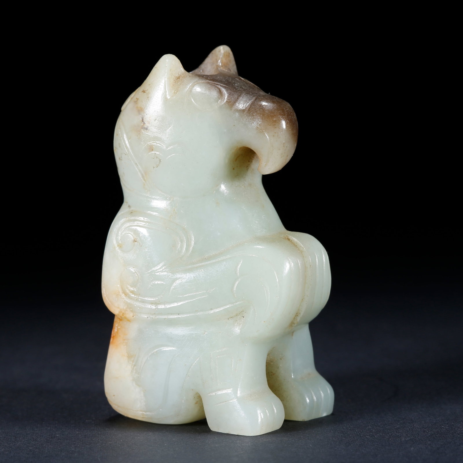 A HETIAN JADE BEAST-SHAPED ORNAMENT (1 of 9)