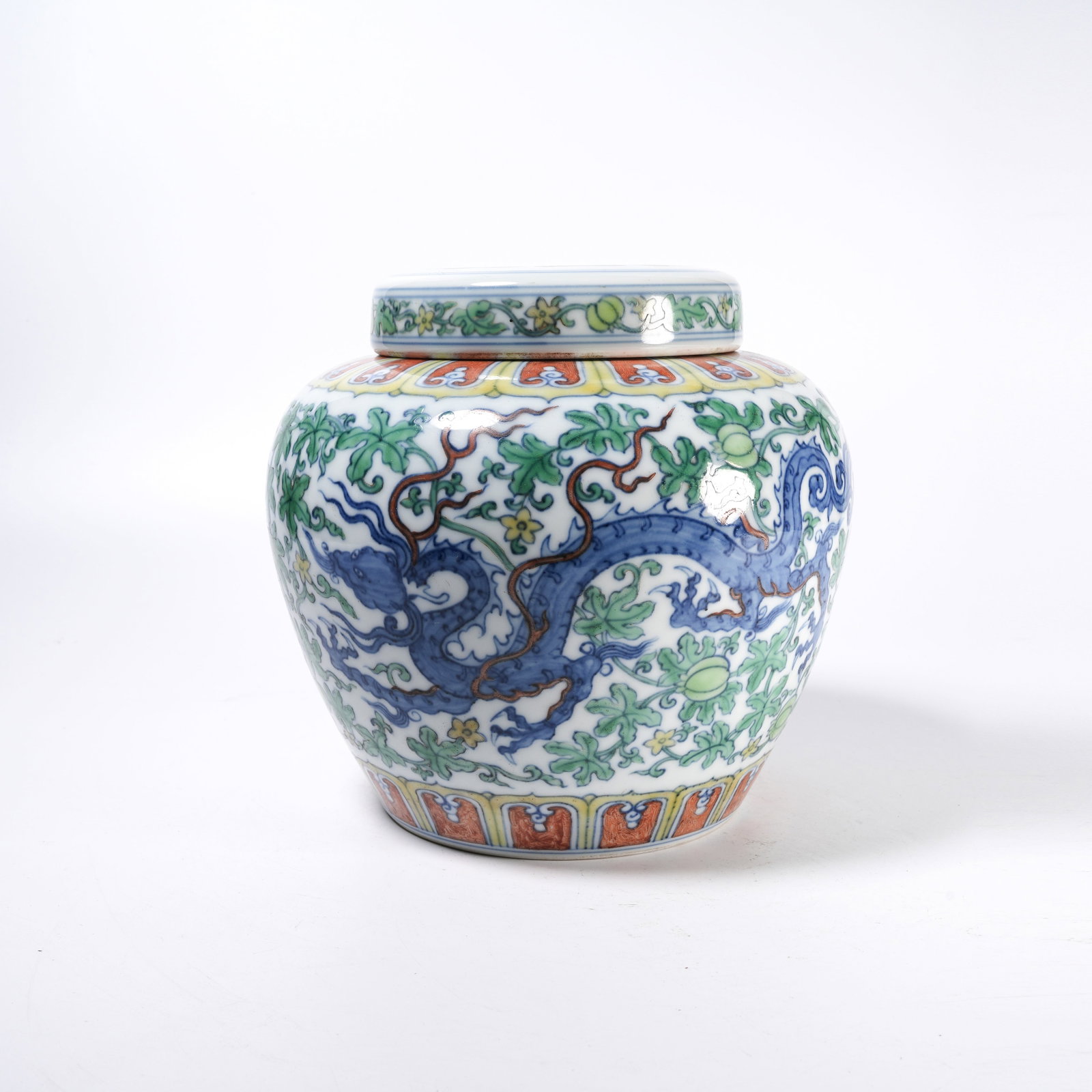 A DOUCAI HEAVENLY CHARACTER JAR WITH INTERTWINING FLORAL AND DRAGON PATTERNS: Doucai Heavenly Character Jar with Intertwining Floral and Dragon Patterns