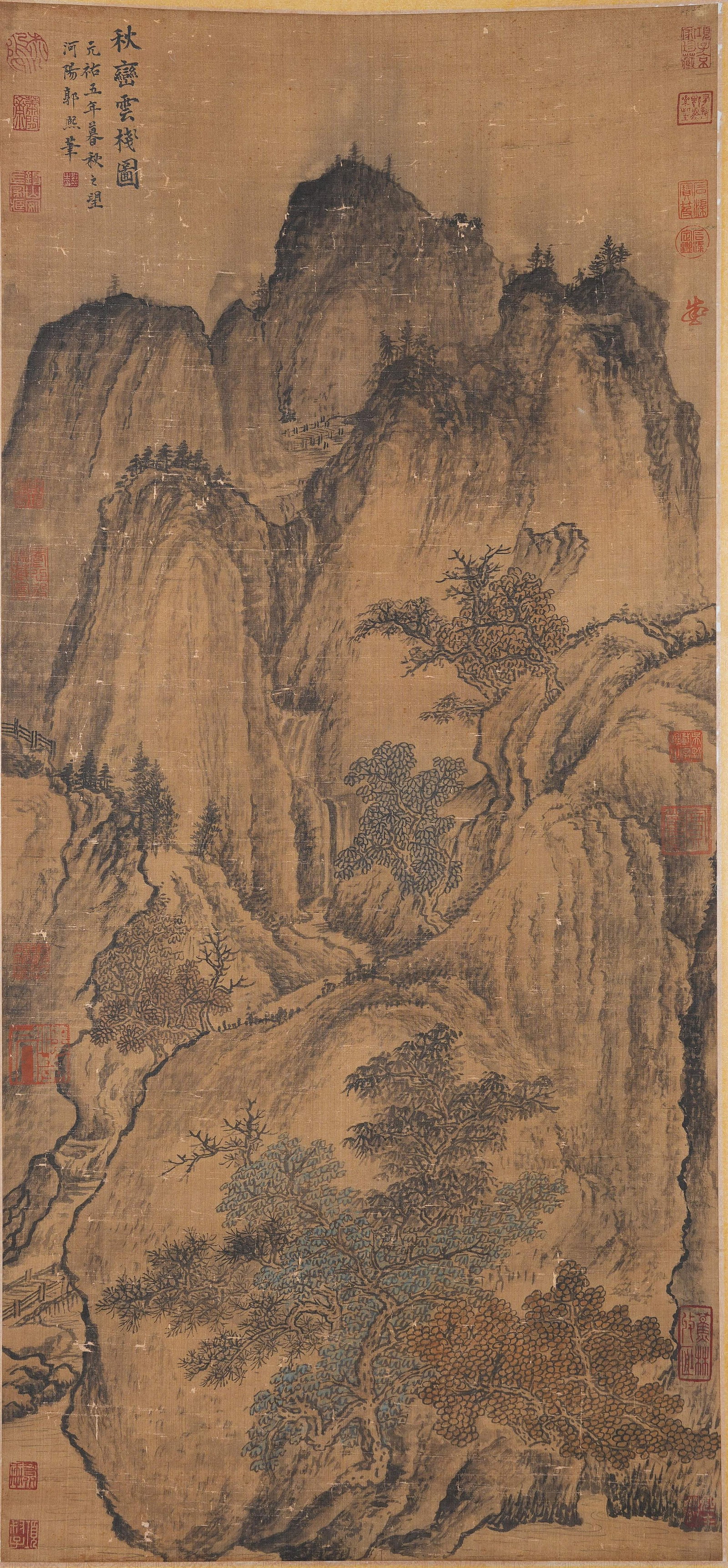 A AUTUMN PEAKS AND CLOUD-WRAPPED PLANK ROAD PAINTING ON SILK BY GUO XI.郭熙: Autumn peaks and cloud-wrapped plank road painting on silk by Guo Xi.郭熙