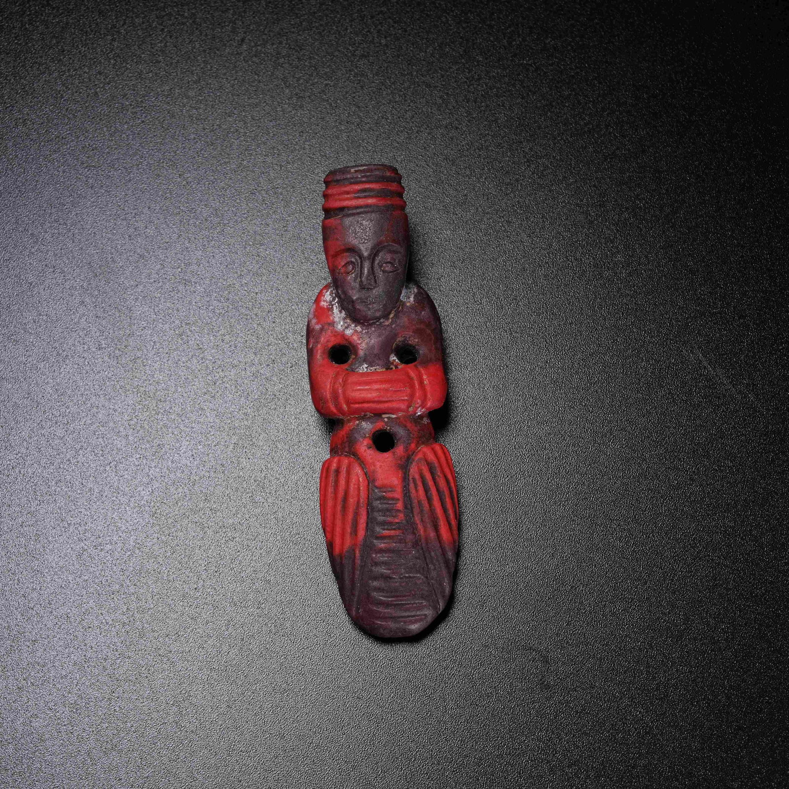 A WARRING STATES RED AGATE FIGURINE PENDANT (1 of 8)