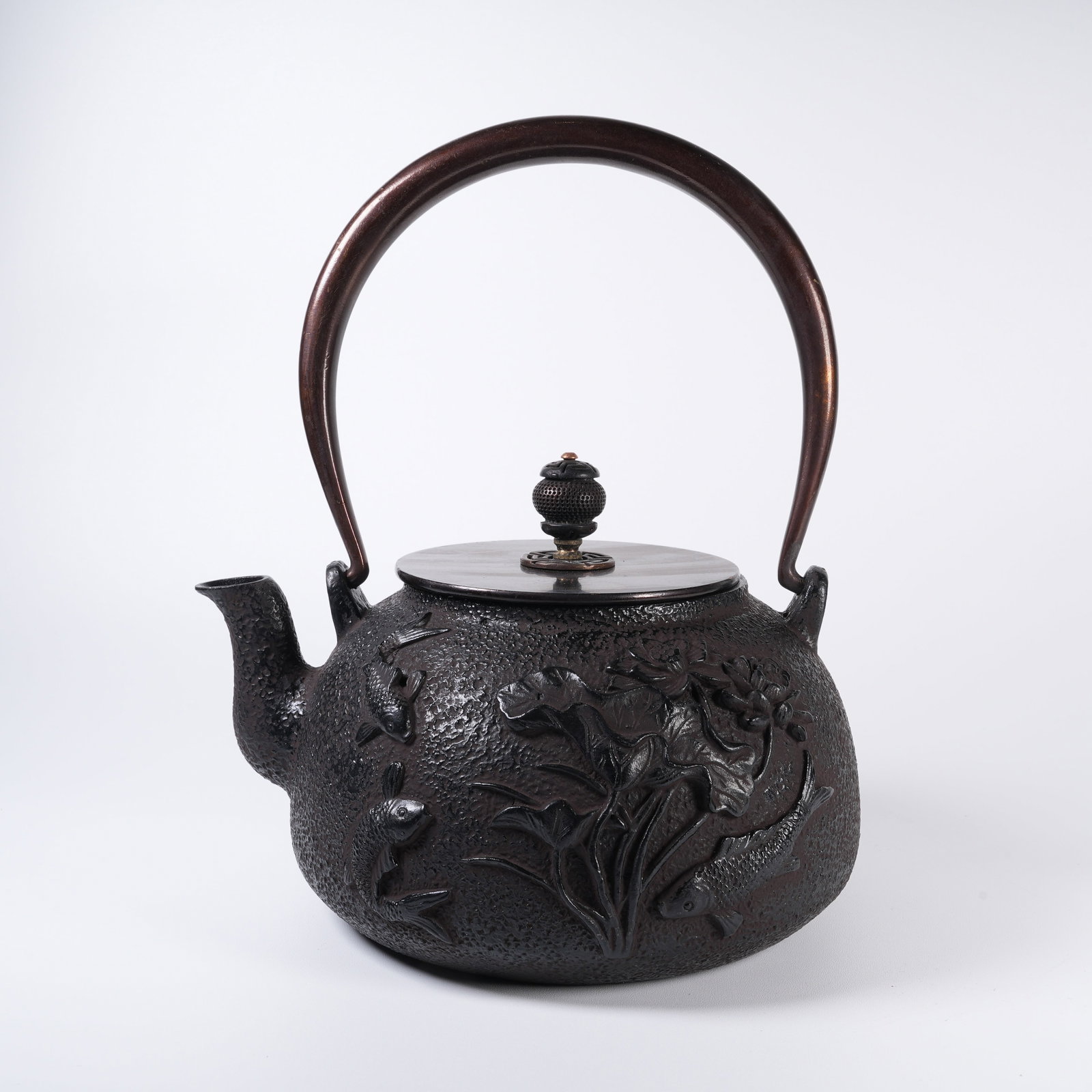 A IRON TEAPOT WITH FISH-AND-AQUATIC-WEED PATTERN (1 of 9)