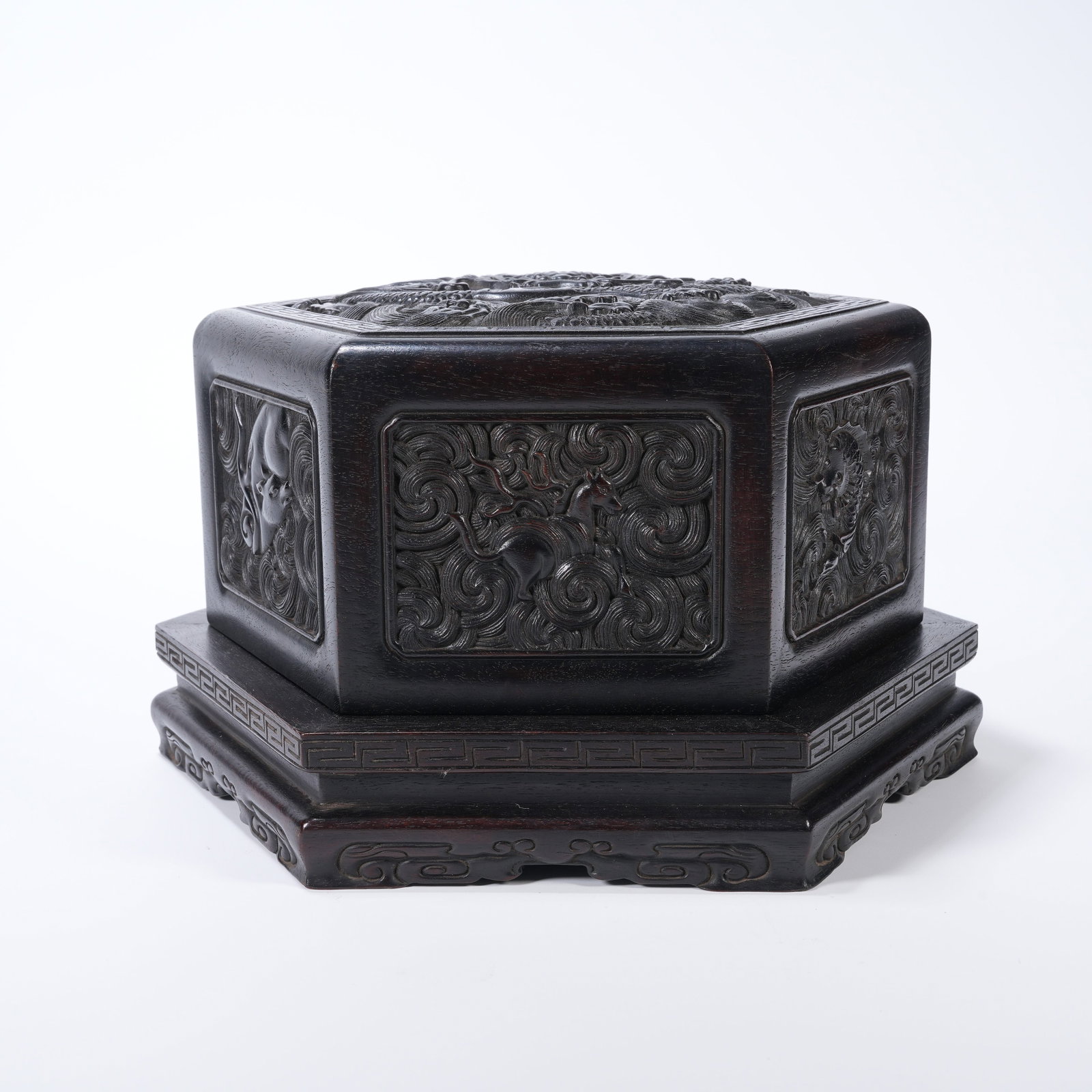 A ZITAN WOOD COVERED BOX CARVED WITH DRAGON PATTERNS: Zitan wood covered box carved with dragon patterns