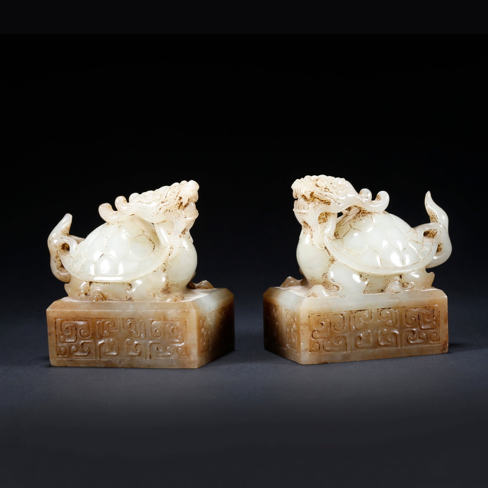 A PAIR OF HETIAN JADE SEALS WITH DRAGON TORTOISE KNOBS (1 of 10)