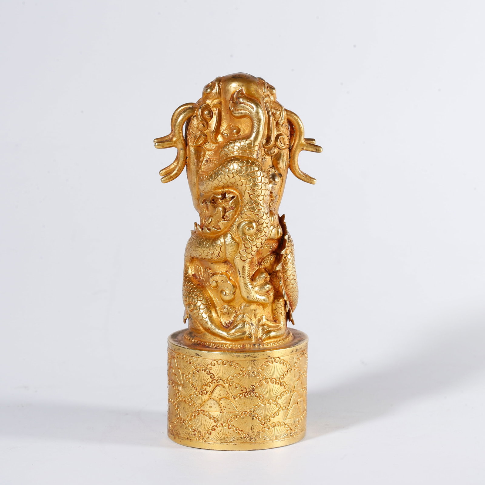 A GILT BRONZE SEAL WITH COILED DRAGON PATTERN: Gilt Bronze Seal with Coiled Dragon Pattern