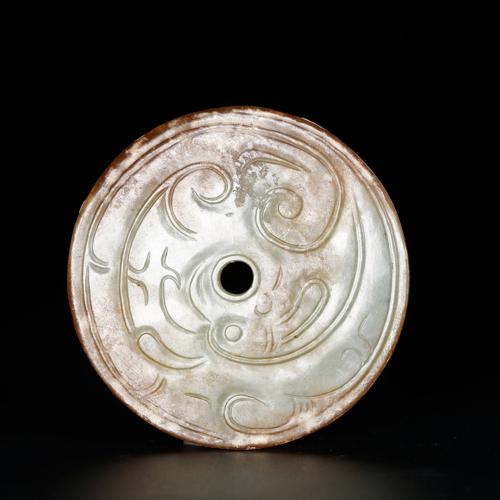A SMALL BI DISC WITH BEAST MOTIFS OF ANCIENT JADE (1 of 8)