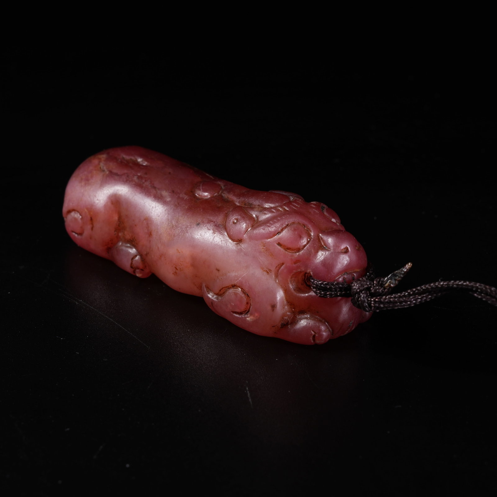 A ARCHAIC JADE AUSPICIOUS BEAST PENDANT: Archaic Jade Auspicious Beast Pendant
