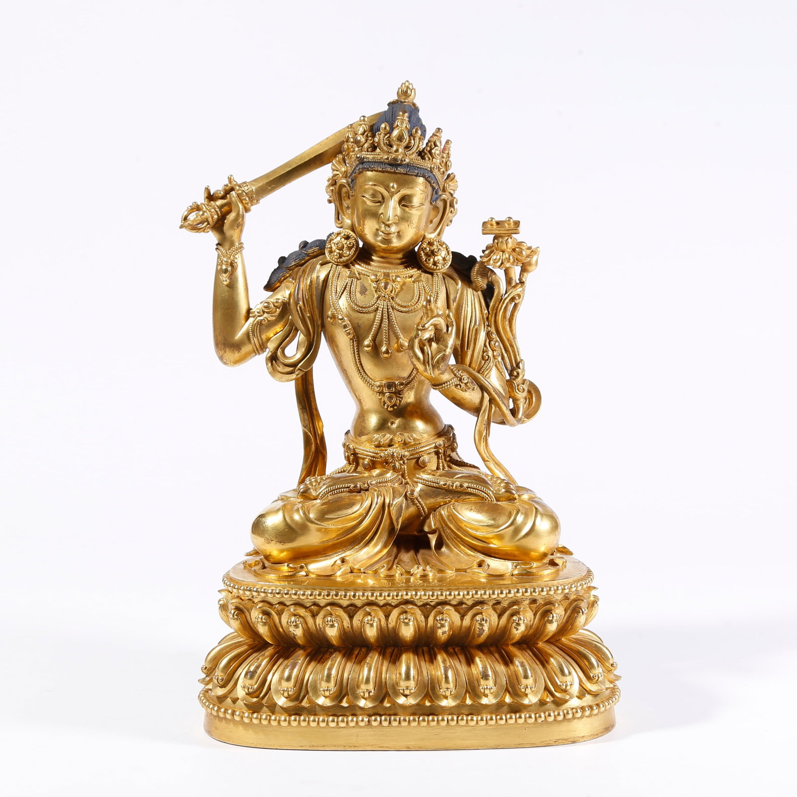 A GILT-BRONZE MANJUSHRI BODHISATTVA FIGURE: Gilt-Bronze Manjushri Bodhisattva Figure