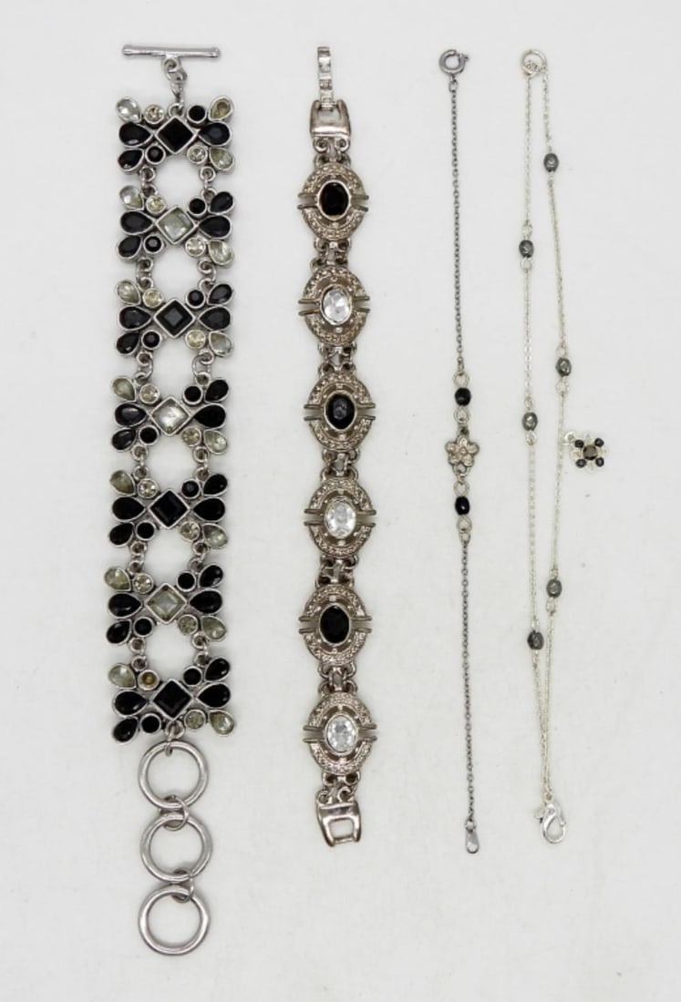 (4) BLACK & CLEAR STYLE BRACELETS: (4) BLACK & CLEAR STYLE BRACELETS