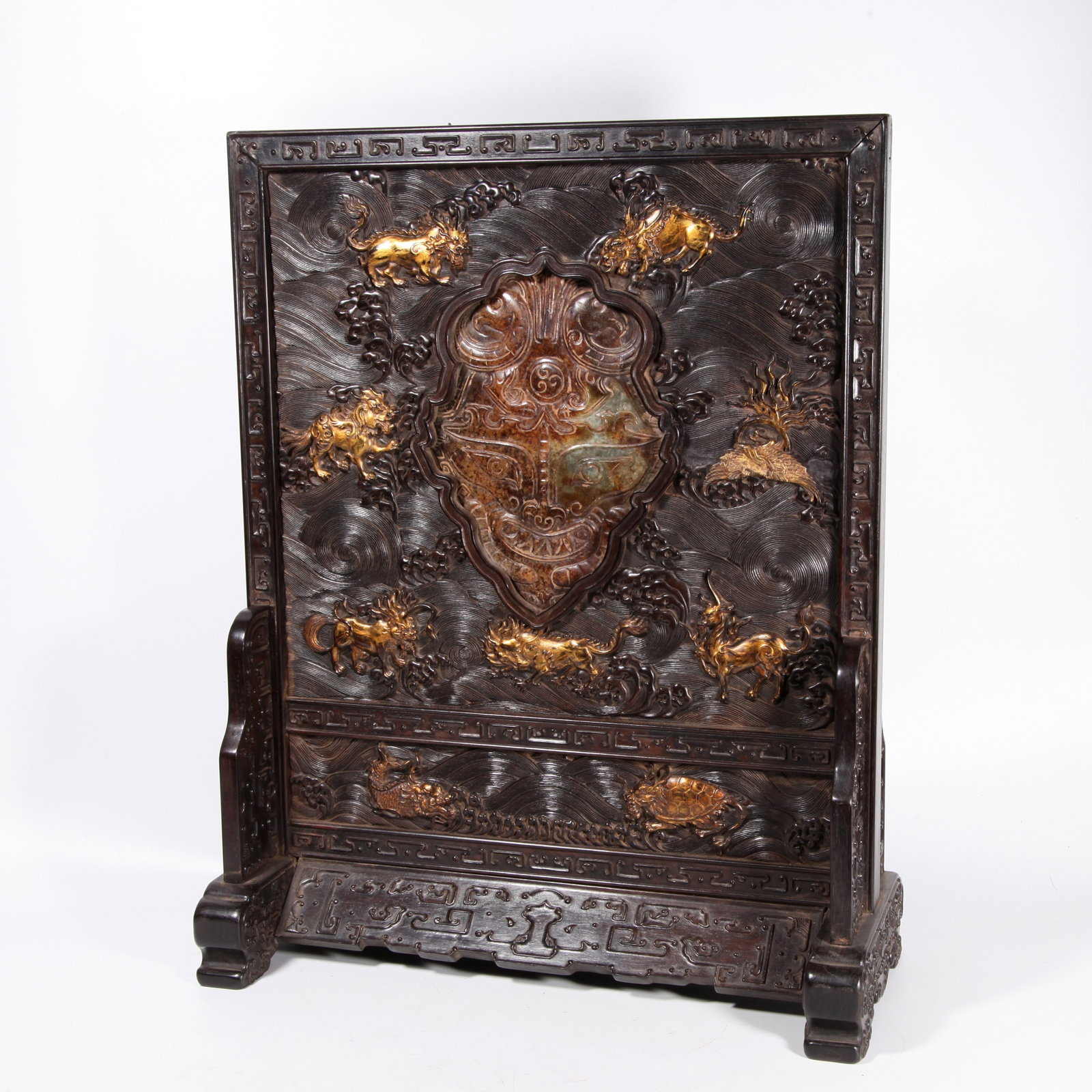 A RED SANDALWOOD FLOOR SCREEN GILDED AND INLAID WITH ARCHAIC JADE BEAST PATTERN: Red sandalwood floor screen gilded and inlaid with archaic jade beast pattern