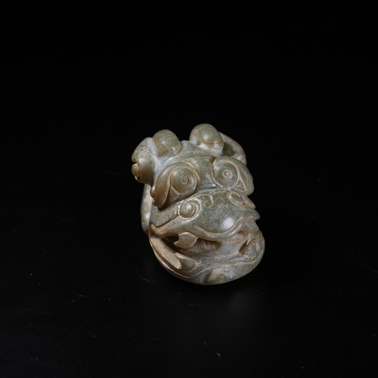 A ARCHAIC JADE DIVINE BEAST PENDANT: Archaic Jade Divine Beast Pendant