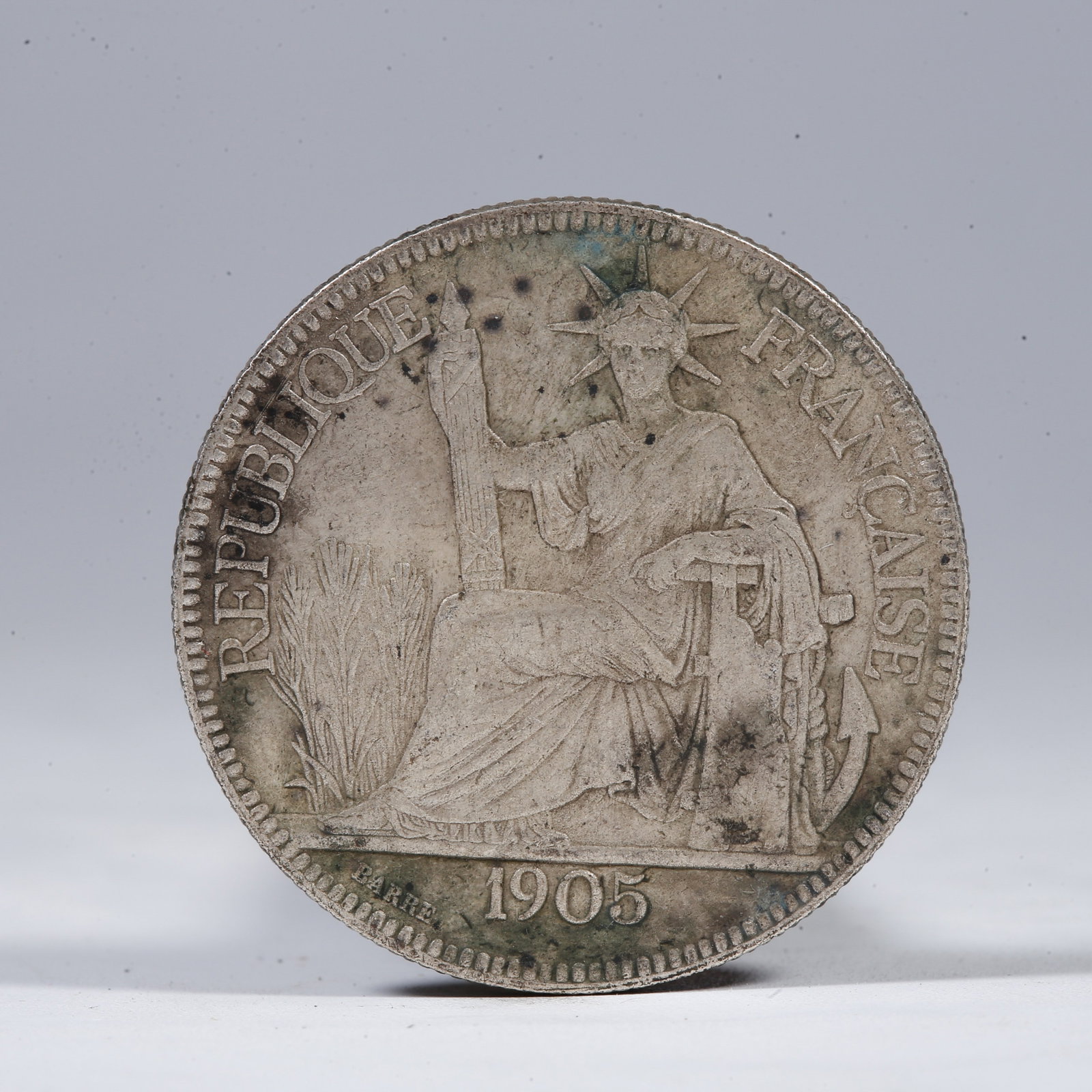 A SILVER DOLLAR COIN: One Silver Dollar Coin