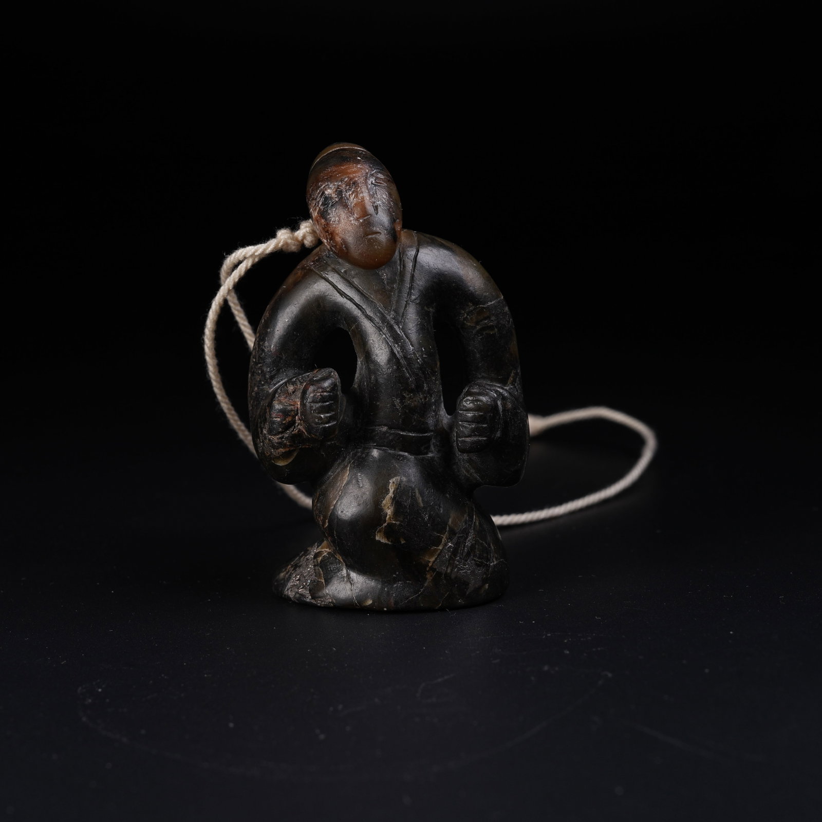 A ANCIENT JADE KNEELING HUMAN FIGURE (1 of 8)