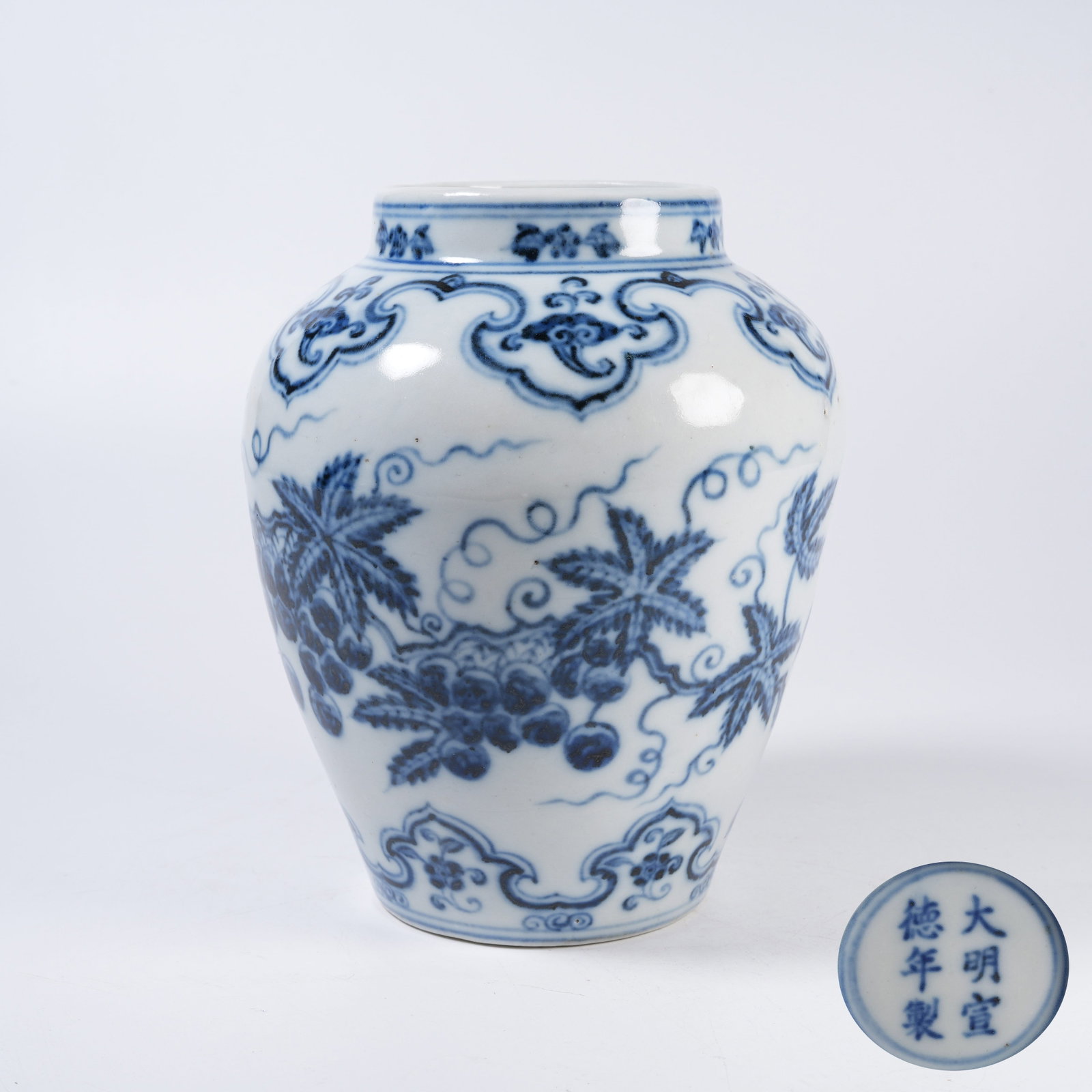 A BLUE AND WHITE JAR WITH FLOWERS AND FRUITS PATTERN (1 of 9)