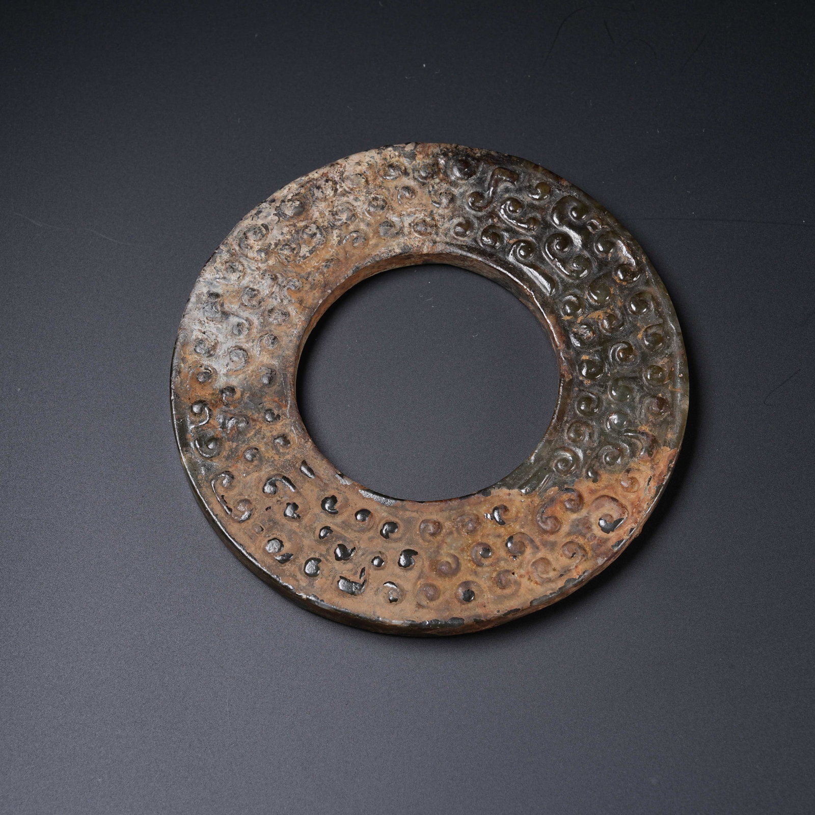 A ANCIENT JADE BI DISC WITH HOOKED CLOUD PATTERNS (1 of 10)