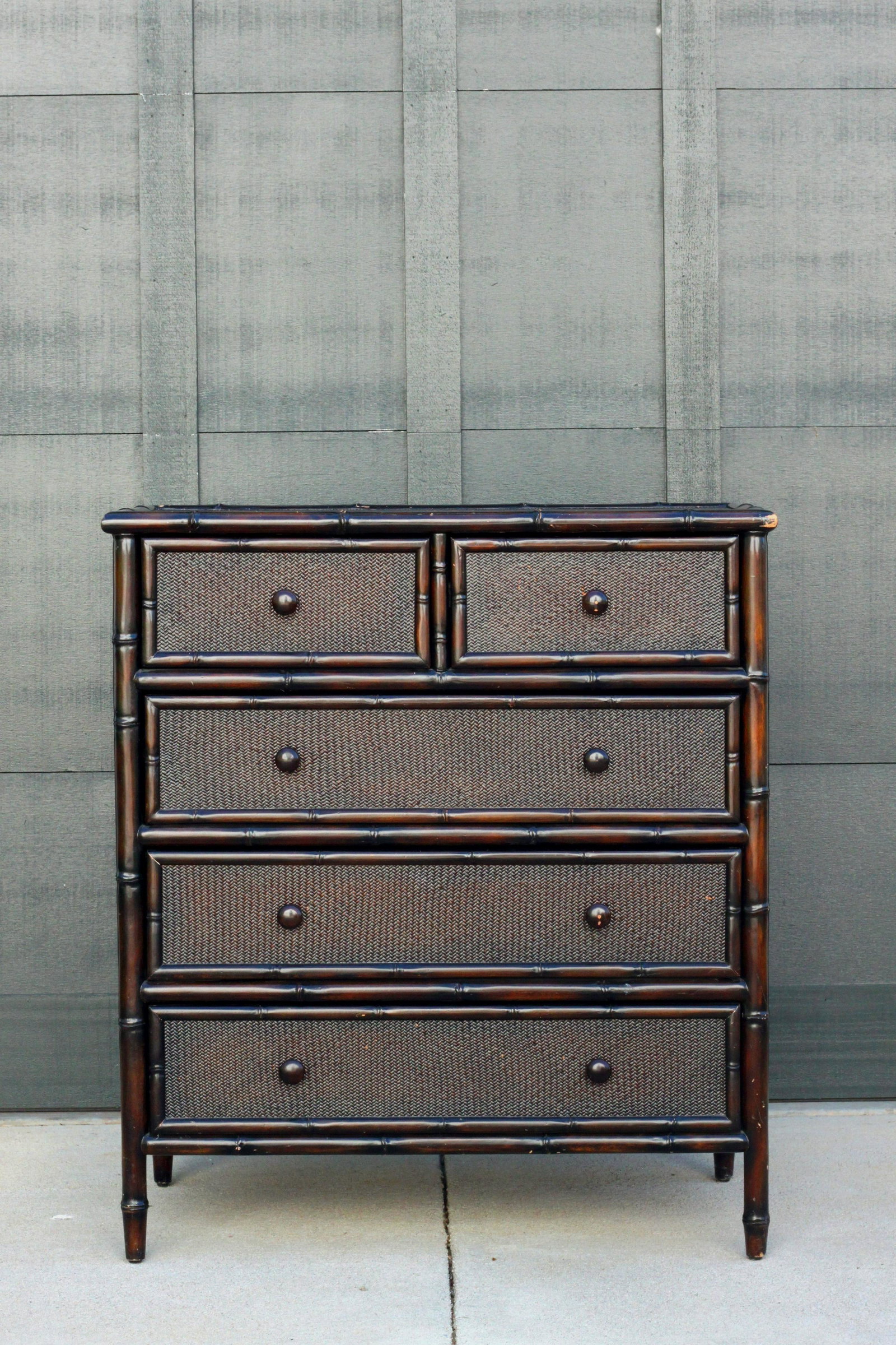 Faux Bamboo and Wicker Dark Brown Contemporary Chest: A faux bamboo two over three chest made of wood with a wicker top. Late 20th or early 21st Century. 39"H x 34.5"W x 19.25"D