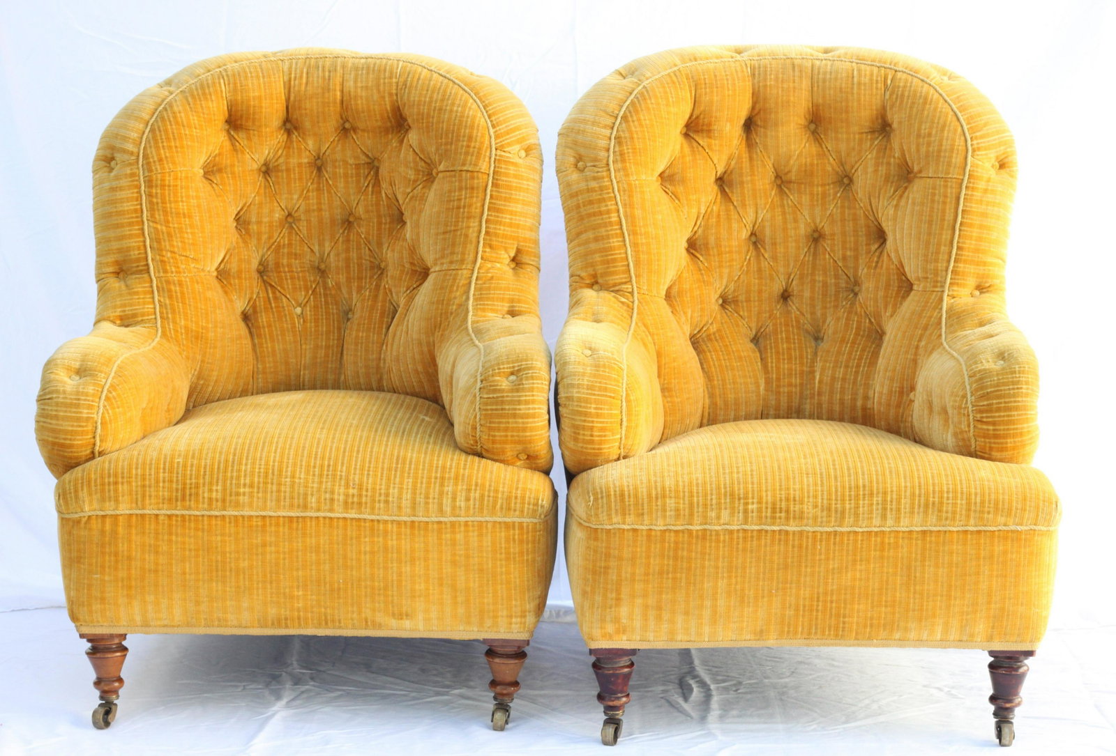 English Cut Velvet Napoleon III Style Club Chairs, a pair: An extraordinary pair of vintage English grandmother and grandfather chairs in a Napoleon III form upholstered in a yellow cut velvet. These chairs were purchased at the Portobello Road Antiques Marke