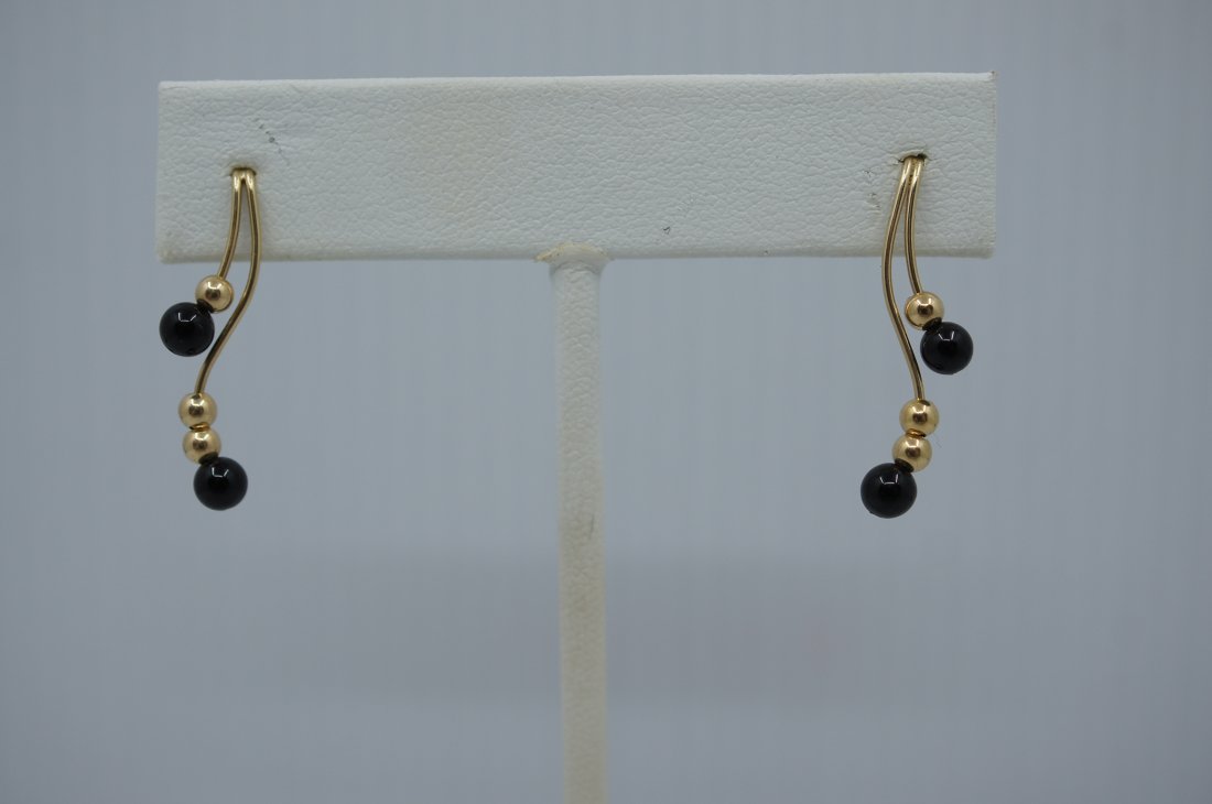 Onyx and Yellow Gold Earrings 14K: Gold & Onyx Dangle Earrings 14K • Dimensions: 27mm long x 5mm wide • 14K Yellow Gold • Hallmark: 14K on post • Friction Backs
