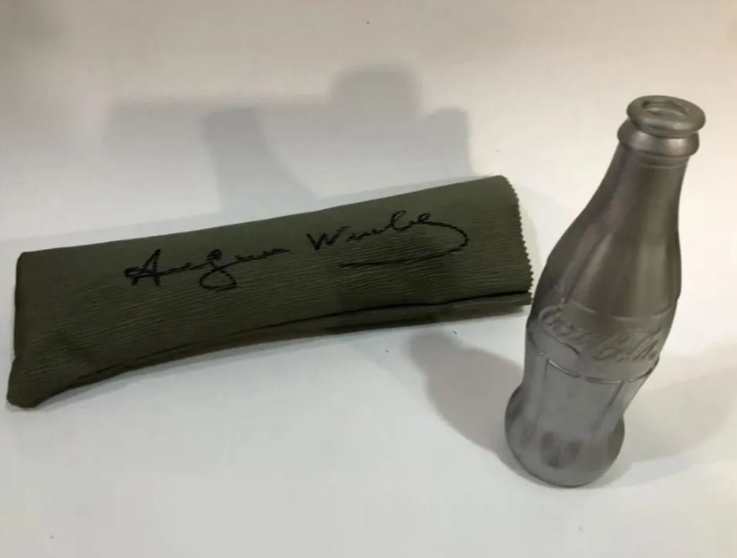Andy Warhol Coca Cola Bottle Signed With Pencil Case And COA: Andy Warholcoca cola bottle, original,signed on the base AW,signed in its case Andy Warhol,light chip missing on the bottle.silver painted,signed with felt-tip pen,without cap,